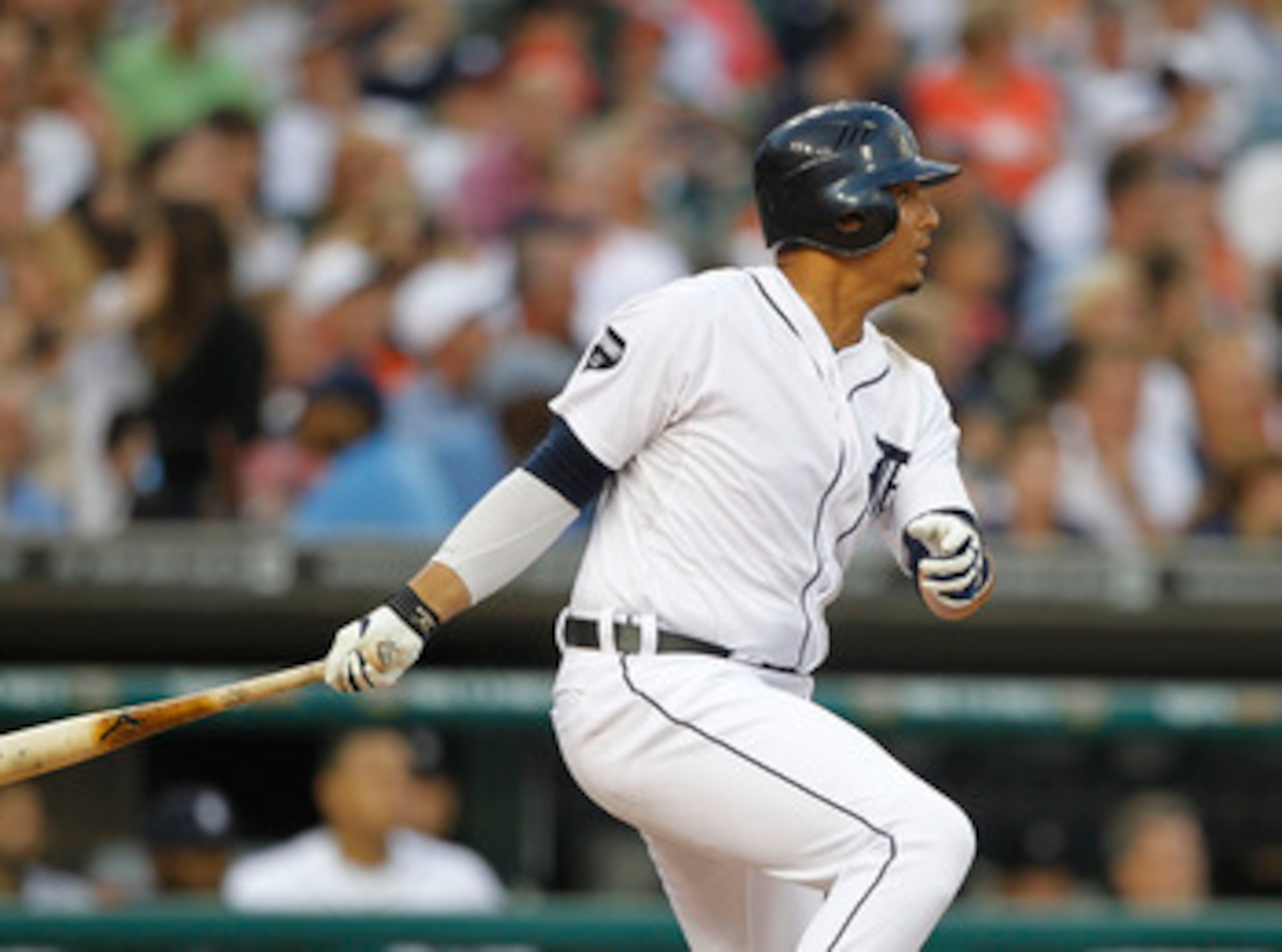 DETROIT - JUNE 11: Victor Martinez #41 of the Detroit Tigers doubles to deep left field in the seventh ining scoring teammate Brennan Boesch #26 during the game against the Seattle Mariners at Comerica Park on June 11, 2011 in Detroit, Michigan. The Tiger
