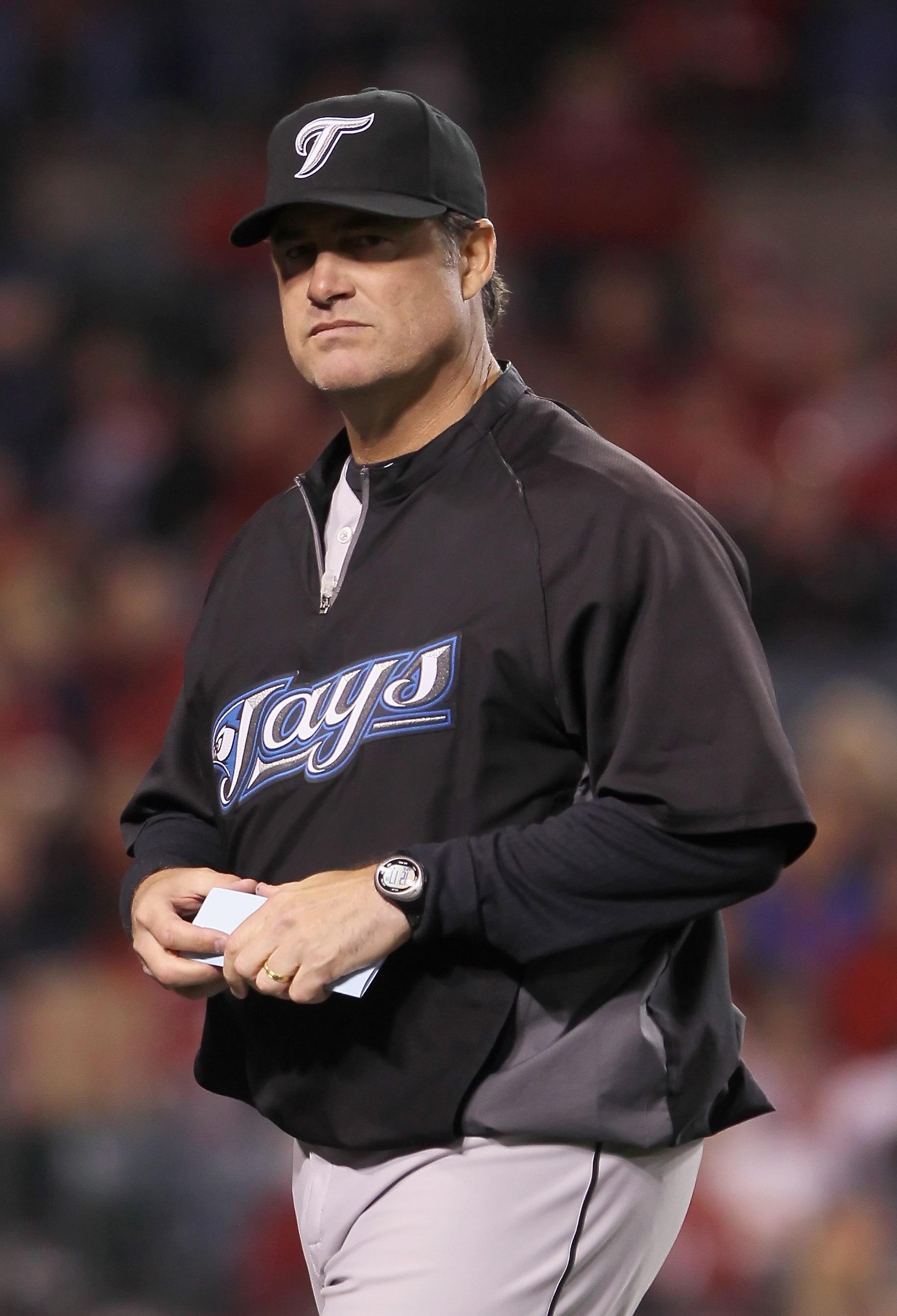 ANAHEIM, CA - APRIL 08:  Toronto Blue Jays manager John Farrell walks back to the dugout in the eighth inning against the Los Angeles Angels of Anaheim at Angel Stadium of Anaheim on April 8, 2011 in Anaheim, California. The Blue Jays defeated the Angels 