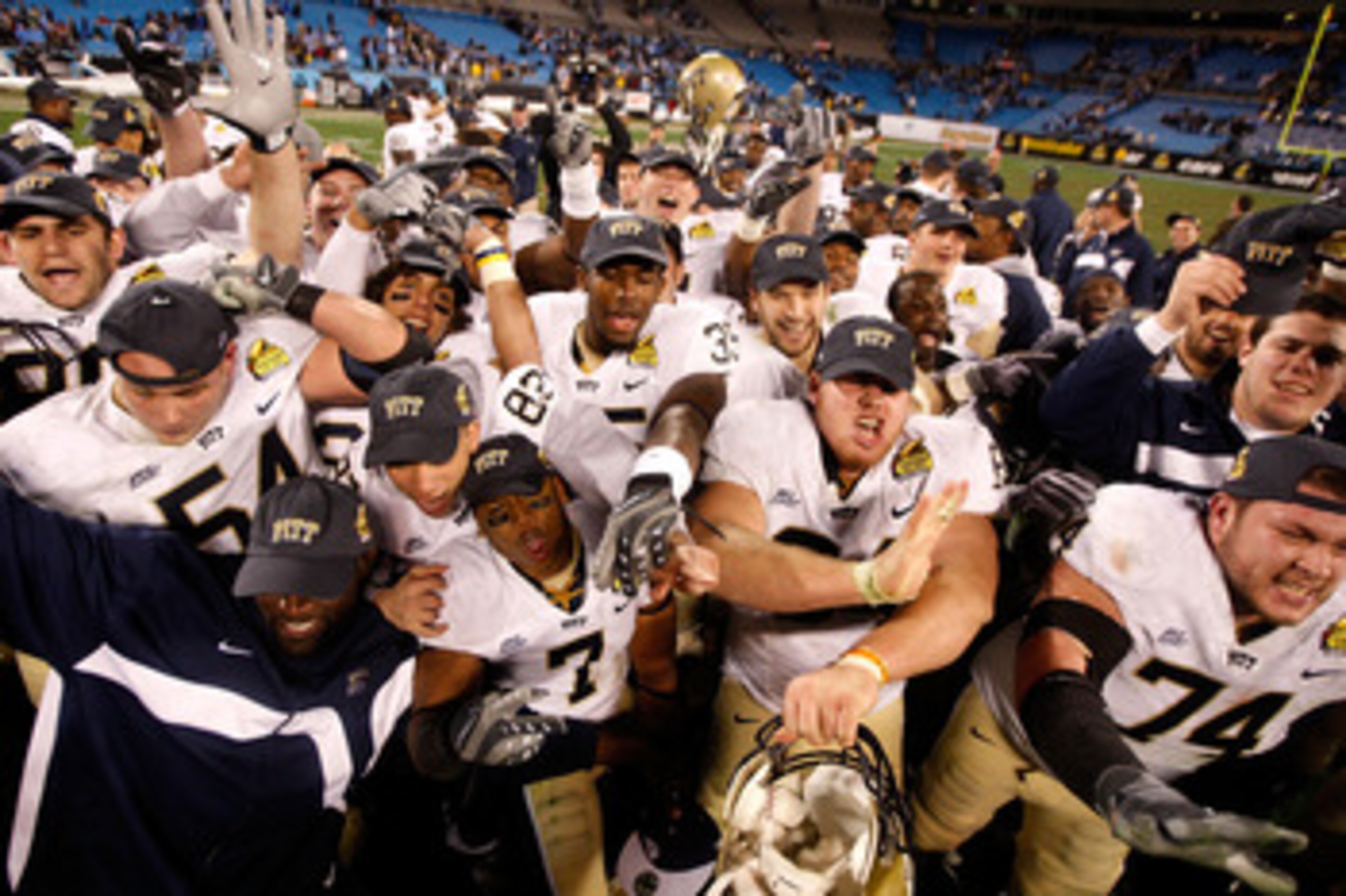 CHARLOTTE, NC - DECEMBER 26: The Pittsburgh Panthers celebrate a 19-17 victory over the North Carolina Tar Heels after their game on December 26, 2009 in Charlotte, North Carolina. (Photo by Streeter Lecka/Getty Images) CHARLOTTE, NC - DECEMBER 26: The Pittsburgh Panthers celebrate a 19-17 victory over the North Carolina Tar Heels after their game on December 26, 2009 in Charlotte, North Carolina. (Photo by Streeter Lecka/Getty Images)
