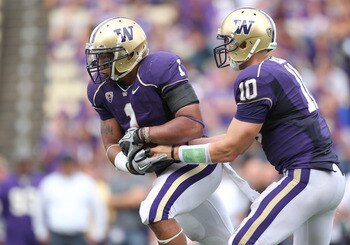 SEATTLE - SEPTEMBER 18: Quarterback Jake Locker #10 of the Washington Huskies hands off to Chris Polk #1 during the game against the Nebraska Cornhuskers on September 18, 2010 at Husky Stadium in Seattle, Washington. (Photo by Otto Greule Jr/Getty Images)