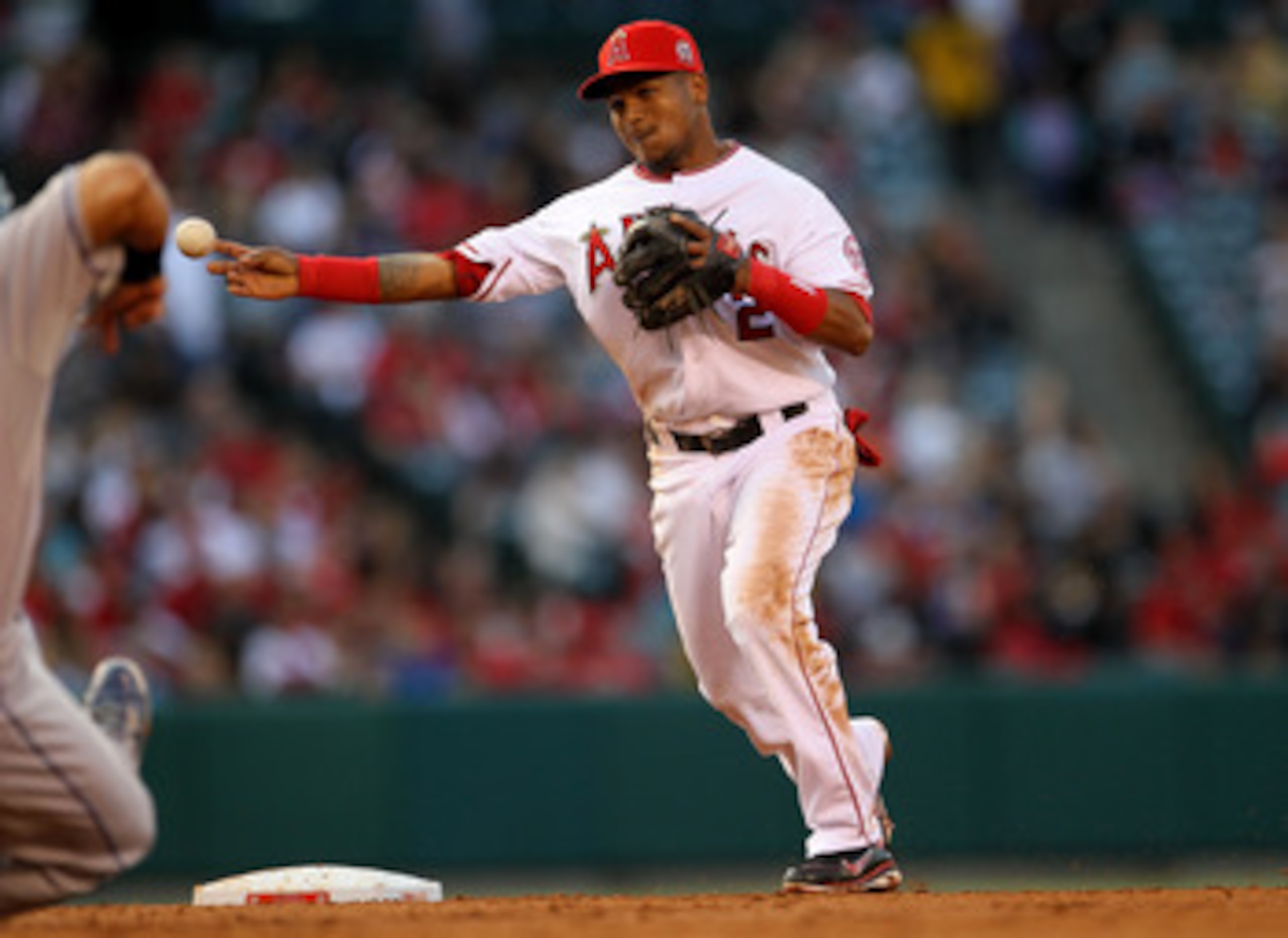 ANAHEIM, CA - JUNE 11:  Erick Aybar #2 of the Los Angeles Angels of Anaheim turns a double playto end the third inning against the Kansas City Royals on June 11, 2011 at Angel Stadium in Anaheim, California.  (Photo by Stephen Dunn/Getty Images)