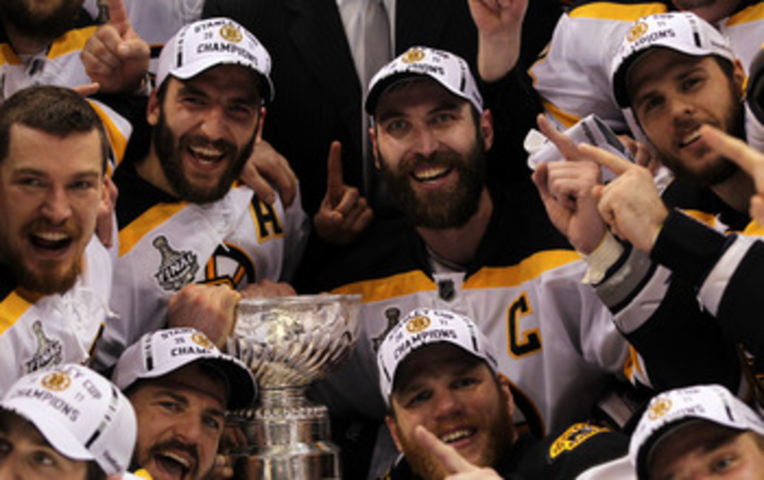 VANCOUVER, BC - JUNE 15: Patrice Bergeron #37, Andrew Ference #21, Mark Recchi #28, Shawn Thornton #22 and Zdeno Chara #33 of the Boston Bruins pose with the Stanley Cup after defeating the Vancouver Canucks in Game Seven of the 2011 NHL Stanley Cup Fina VANCOUVER, BC - JUNE 15: Patrice Bergeron #37, Andrew Ference #21, Mark Recchi #28, Shawn Thornton #22 and Zdeno Chara #33 of the Boston Bruins pose with the Stanley Cup after defeating the Vancouver Canucks in Game Seven of the 2011 NHL Stanley Cup Fina