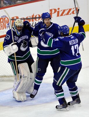 VANCOUVER, BC - JUNE 10:  Roberto Luongo #1, Alexander Edler #23 and Ryan Kesler #17 of the Vancouver Canucks celebrate after defeating the Boston Bruins by a score of 1-0 in Game Five of the 2011 NHL Stanley Cup Final at Rogers Arena on June 10, 2011 in