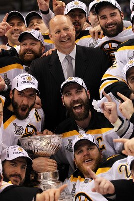 VANCOUVER, BC - JUNE 15:  Head coach Claude Julien, Tim Thomas #30, Patrice Bergeron #37 and Zdeno Chara #33 of the Boston Bruins pose with the Stanley Cup after defeating the Vancouver Canucks in Game Seven of the 2011 NHL Stanley Cup Final at Rogers Are
