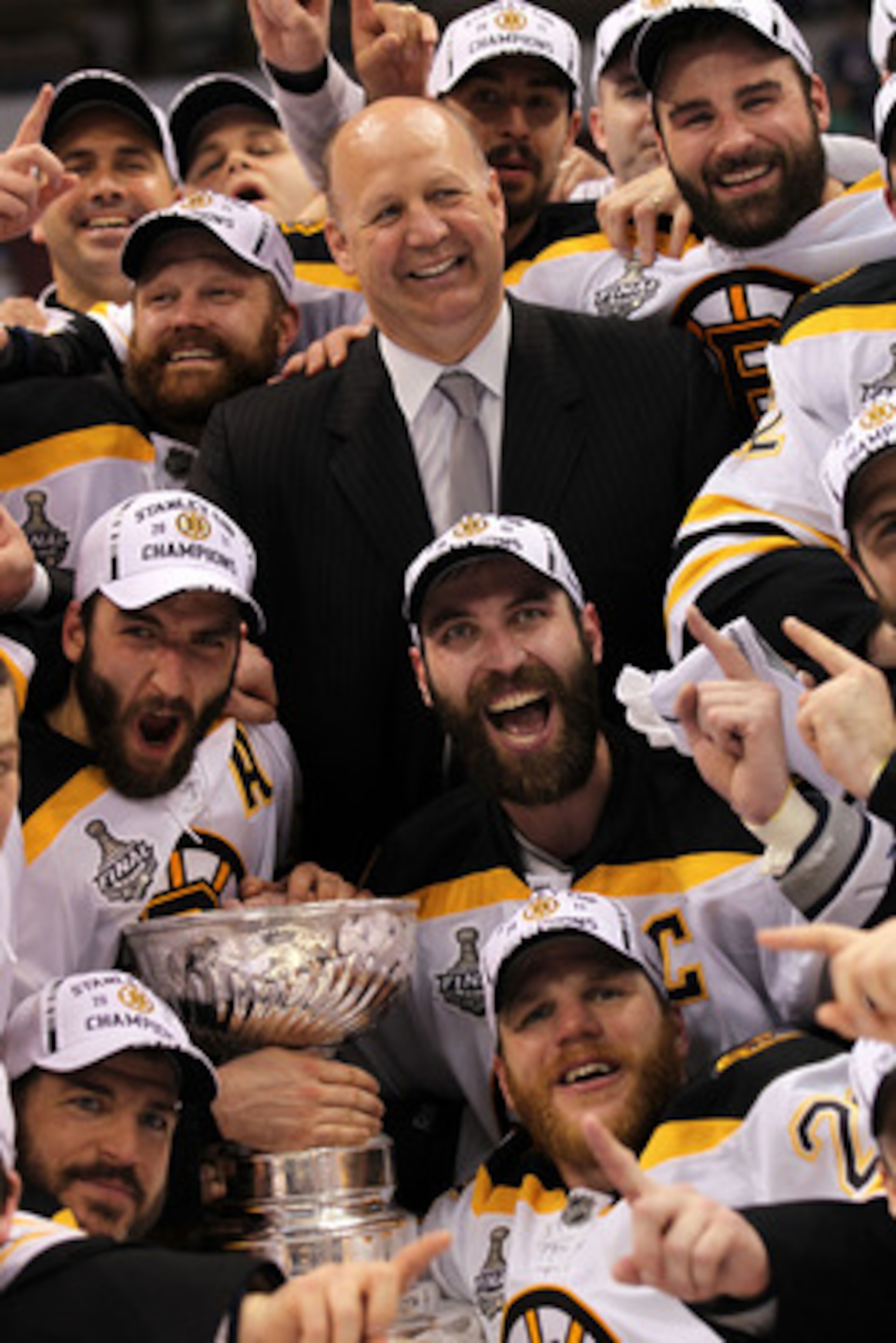VANCOUVER, BC - JUNE 15: Head coach Claude Julien, Tim Thomas #30, Patrice Bergeron #37 and Zdeno Chara #33 of the Boston Bruins pose with the Stanley Cup after defeating the Vancouver Canucks in Game Seven of the 2011 NHL Stanley Cup Final at Rogers Are VANCOUVER, BC - JUNE 15: Head coach Claude Julien, Tim Thomas #30, Patrice Bergeron #37 and Zdeno Chara #33 of the Boston Bruins pose with the Stanley Cup after defeating the Vancouver Canucks in Game Seven of the 2011 NHL Stanley Cup Final at Rogers Are