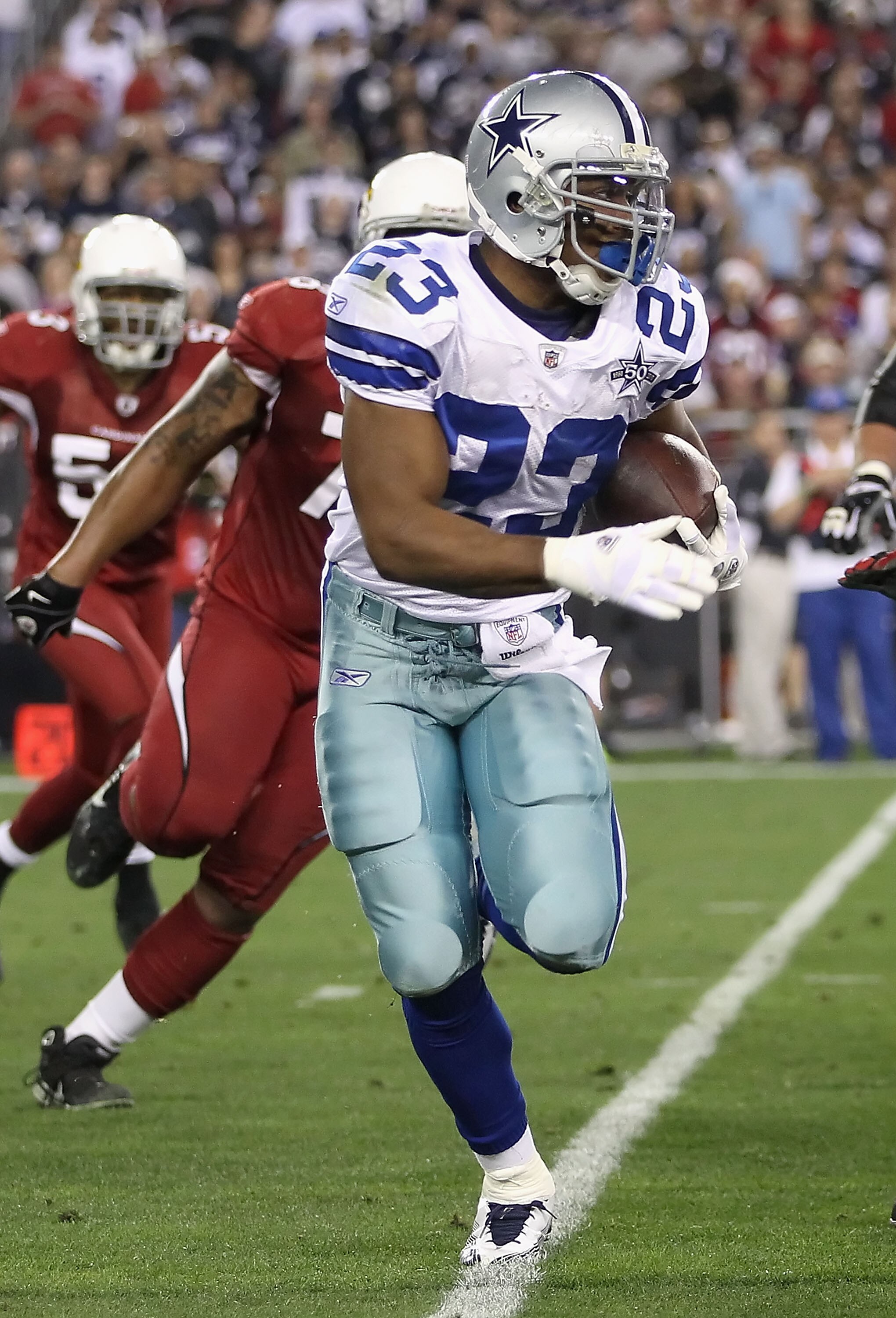 GLENDALE, AZ - DECEMBER 25:  Runningback Tashard Choice #23 of the Dallas Cowboys rushes the football against the Arizona Cardinals during the NFL game at the University of Phoenix Stadium on December 25, 2010 in Glendale, Arizona.  The Cardinals defeated