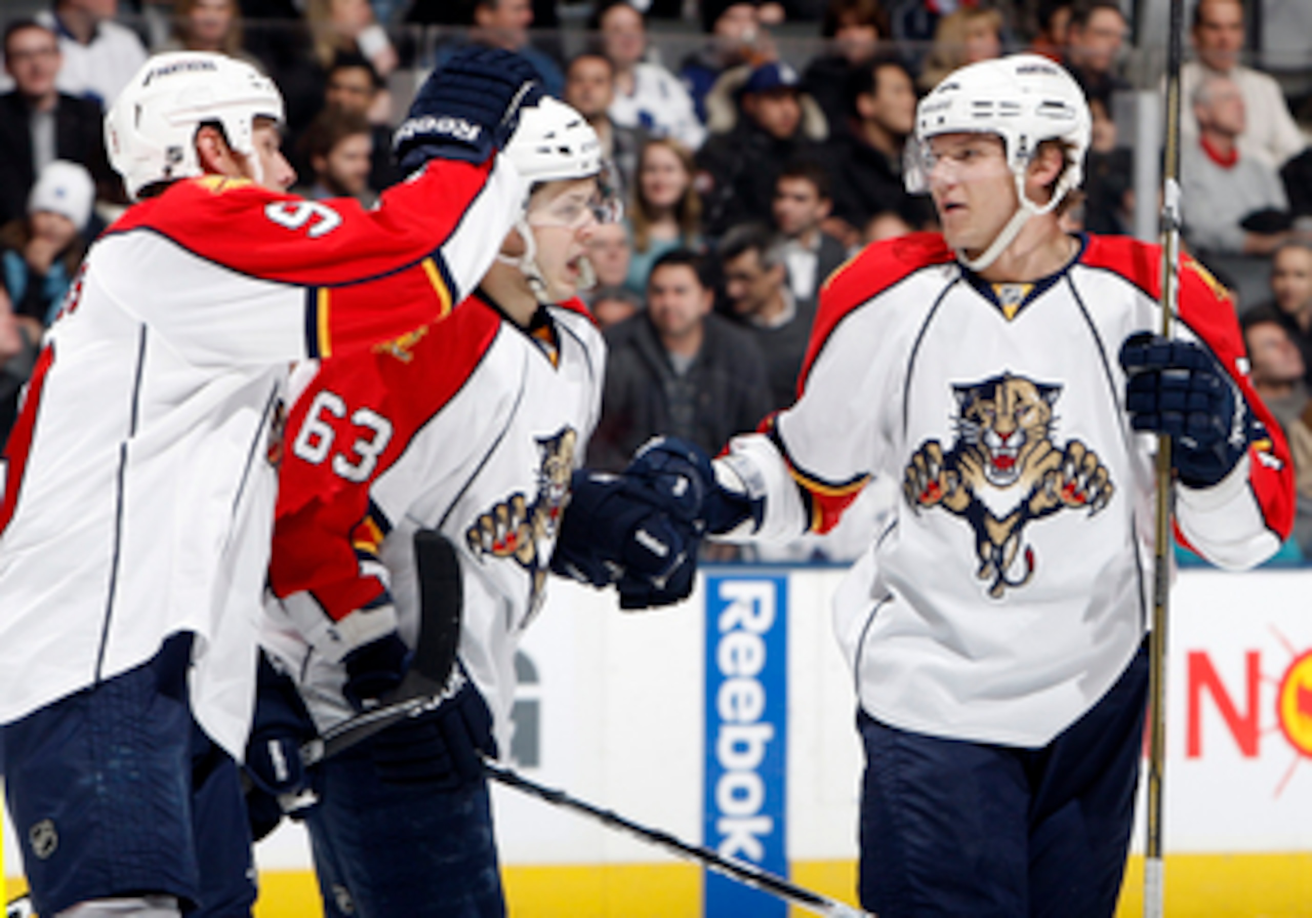 TORONTO, CANADA - FEBRUARY 1: Stephen Weiss #9, Evgeni Dadonov #63 and Dmitry Kulikov #7 of the Florida Panthers celebrate goal against the Toronto Maple Leafs during game action at the Air Canada Centre February 1, 2011 in Toronto, Ontario, Canada. (Ph TORONTO, CANADA - FEBRUARY 1: Stephen Weiss #9, Evgeni Dadonov #63 and Dmitry Kulikov #7 of the Florida Panthers celebrate goal against the Toronto Maple Leafs during game action at the Air Canada Centre February 1, 2011 in Toronto, Ontario, Canada. (Ph