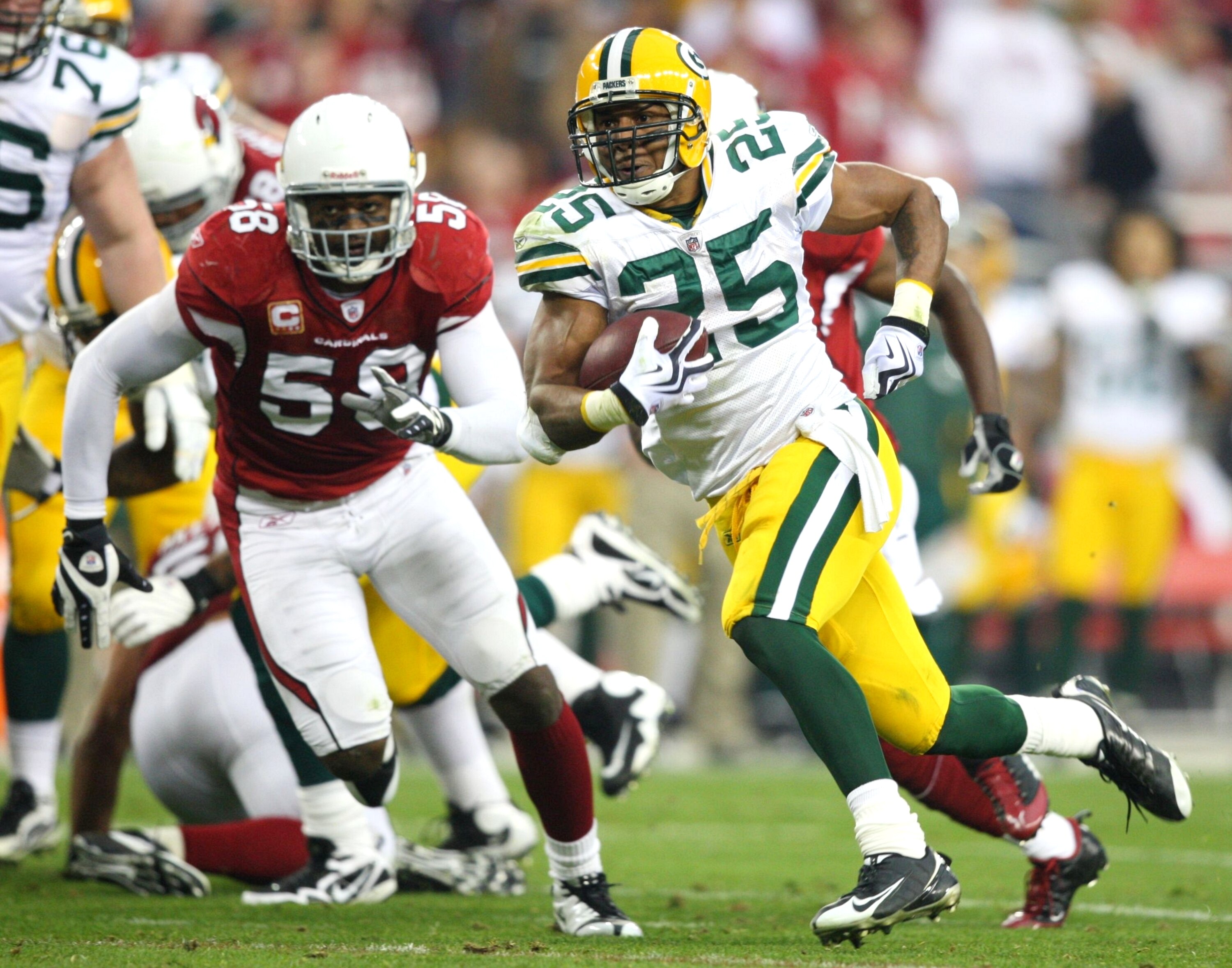 GLENDALE, AZ - JANUARY 10:  Ryan Grant #25 of the Green Bay Packers runs with the ball against the Arizona Cardinals during the 2010 NFC wild-card playoff game at University of Phoenix Stadium on January 10, 2010 in Glendale, Arizona.  (Photo by Christian