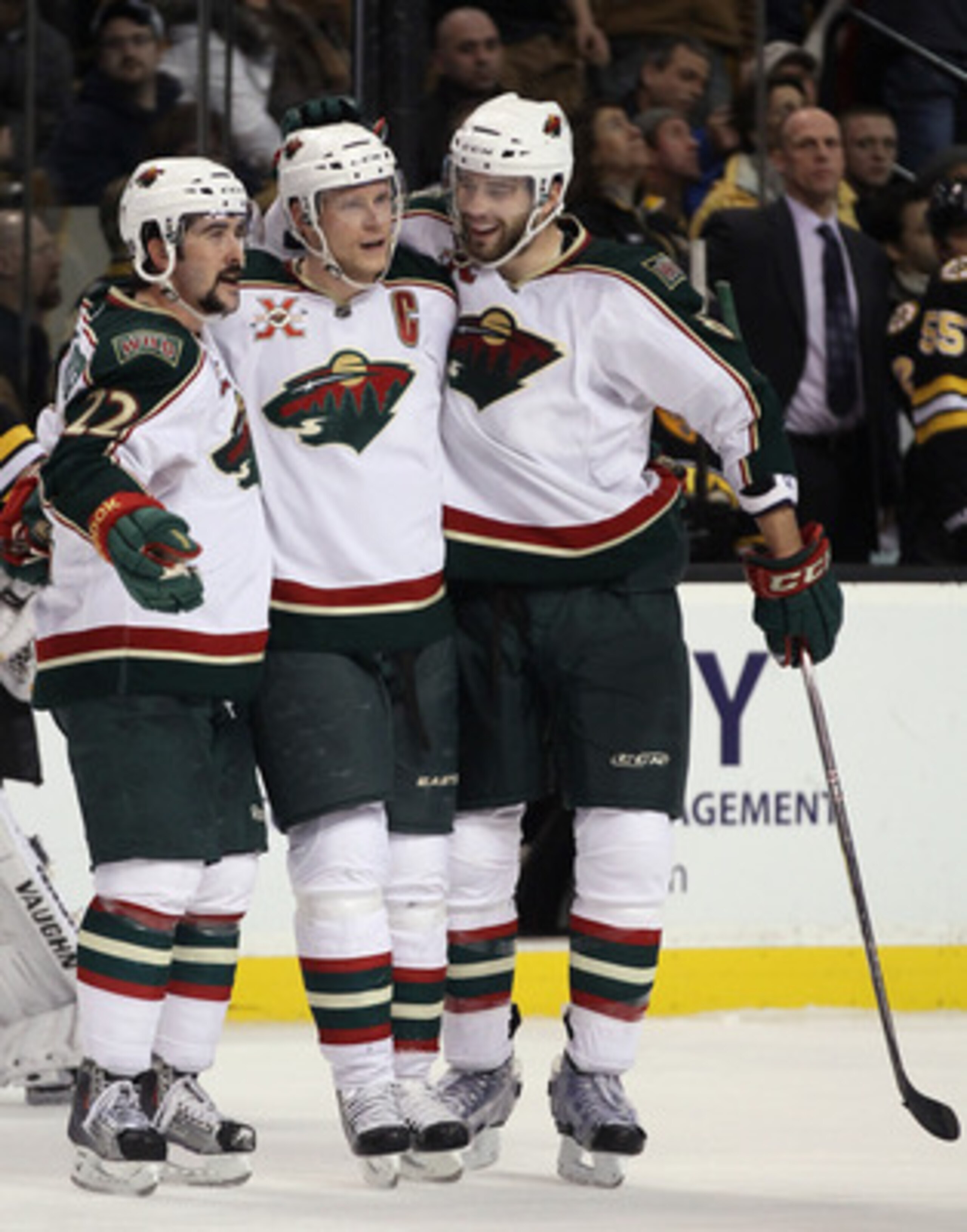 BOSTON, MA - JANUARY 06: Mikko Koivu #9 of the Minnesota Wild is congratulated by teammates Cal Clutterbuck #22 and Brent Burns #8 after Koivu scored the empty net goal against the Boston Bruins on January 6, 2010 at the TD Garden in Boston, Massachusett BOSTON, MA - JANUARY 06: Mikko Koivu #9 of the Minnesota Wild is congratulated by teammates Cal Clutterbuck #22 and Brent Burns #8 after Koivu scored the empty net goal against the Boston Bruins on January 6, 2010 at the TD Garden in Boston, Massachusett