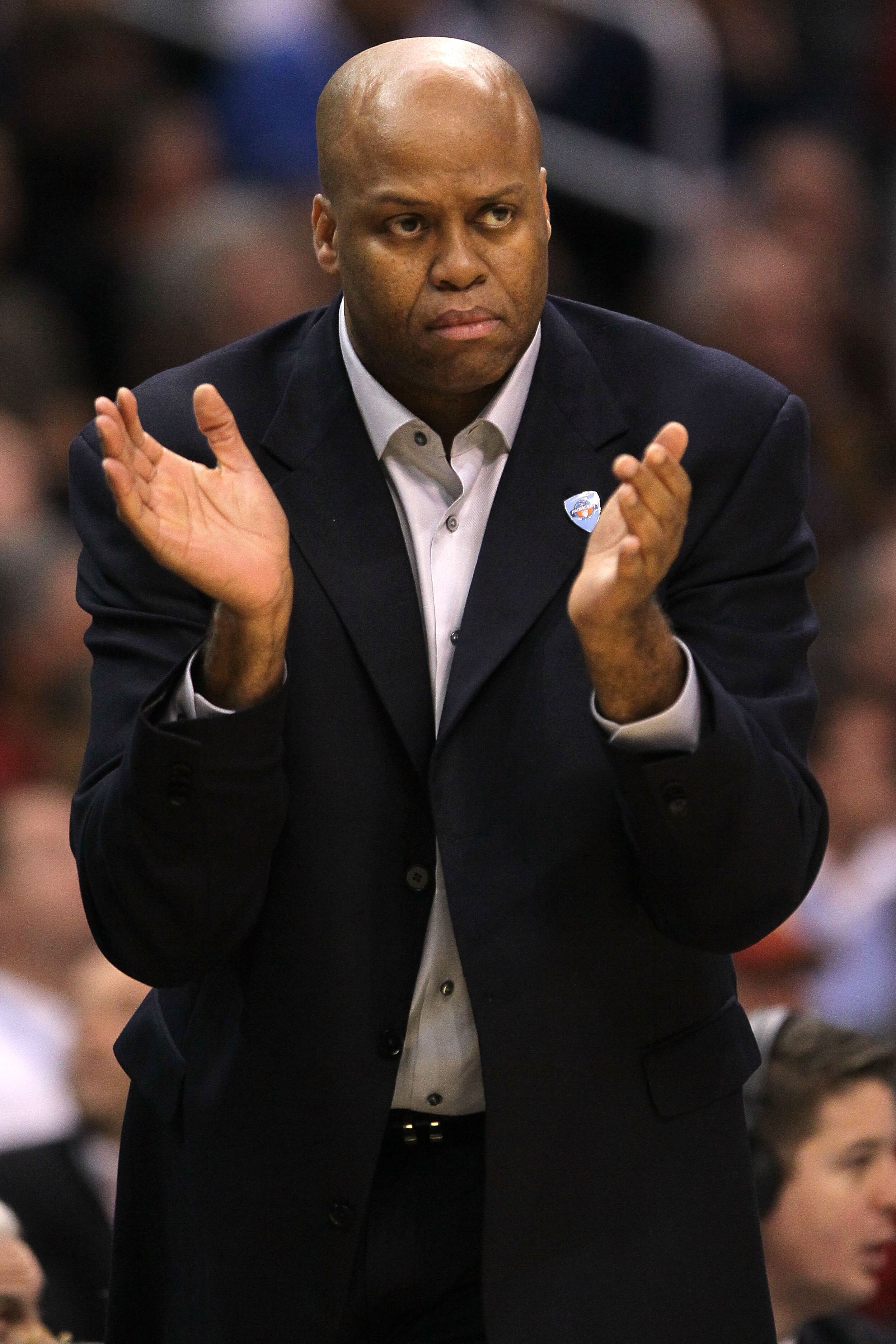 LOS ANGELES, CA - MARCH 10:  Head coach Craig Robinson of the Oregon State Beavers claps in the first half while taking on the Arizona Wildcats in the quarterfinals of the 2011 Pacific Life Pac-10 Men's Basketball Tournament at Staples Center on March 10,