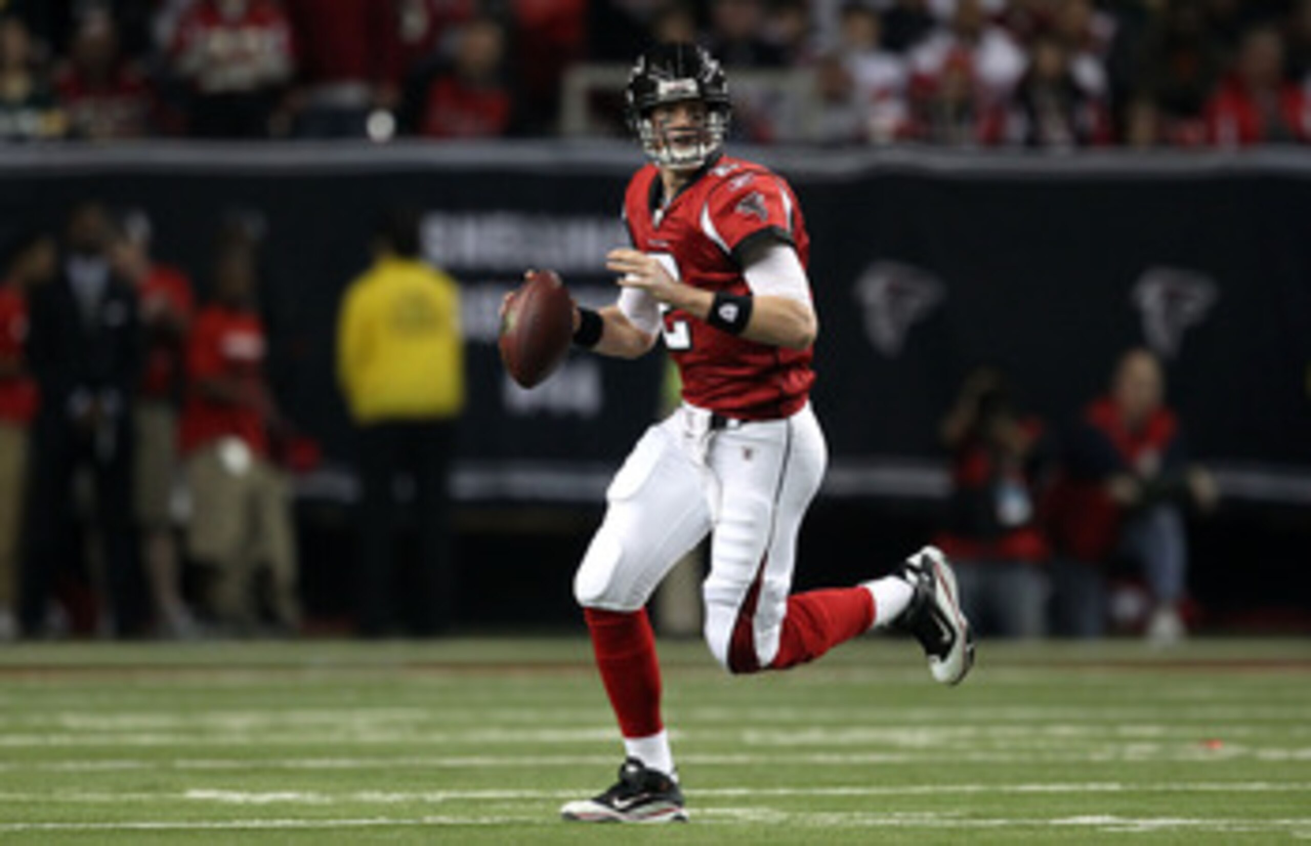 ATLANTA, GA - JANUARY 15:  Quarterback Matt Ryan #2 of the Atlanta Falcons rolls out to pass against the Green Bay Packers during their 2011 NFC divisional playoff game at Georgia Dome on January 15, 2011 in Atlanta, Georgia. The Packers won 48-21.  (Phot