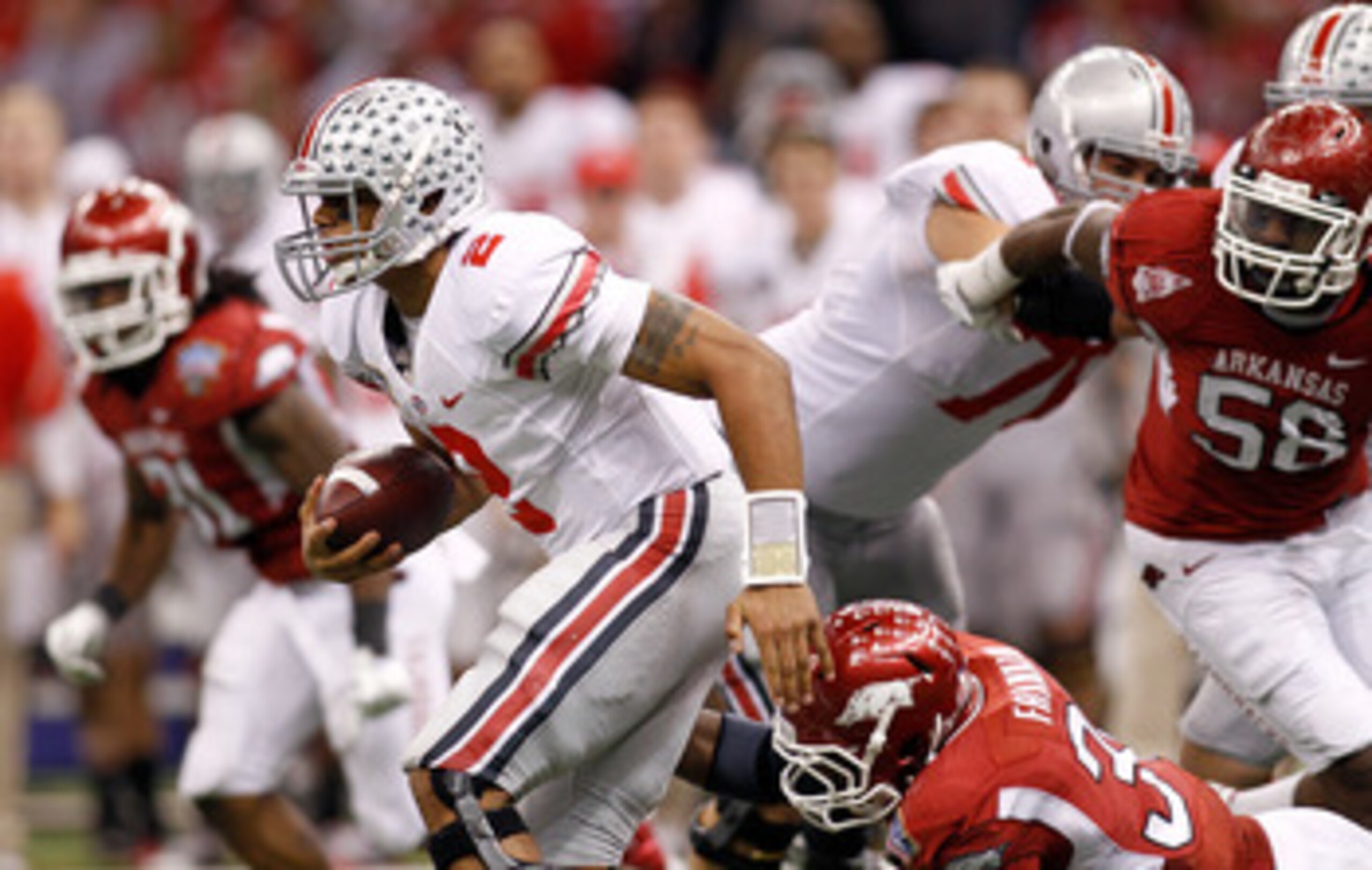 NEW ORLEANS, LA - JANUARY 04:  Terrelle Pryor #2 of the Ohio State Buckeyes runs with the ball in the second half against the Arkansas Razorbacks during the Allstate Sugar Bowl at the Louisiana Superdome on January 4, 2011 in New Orleans, Louisiana.  (Pho