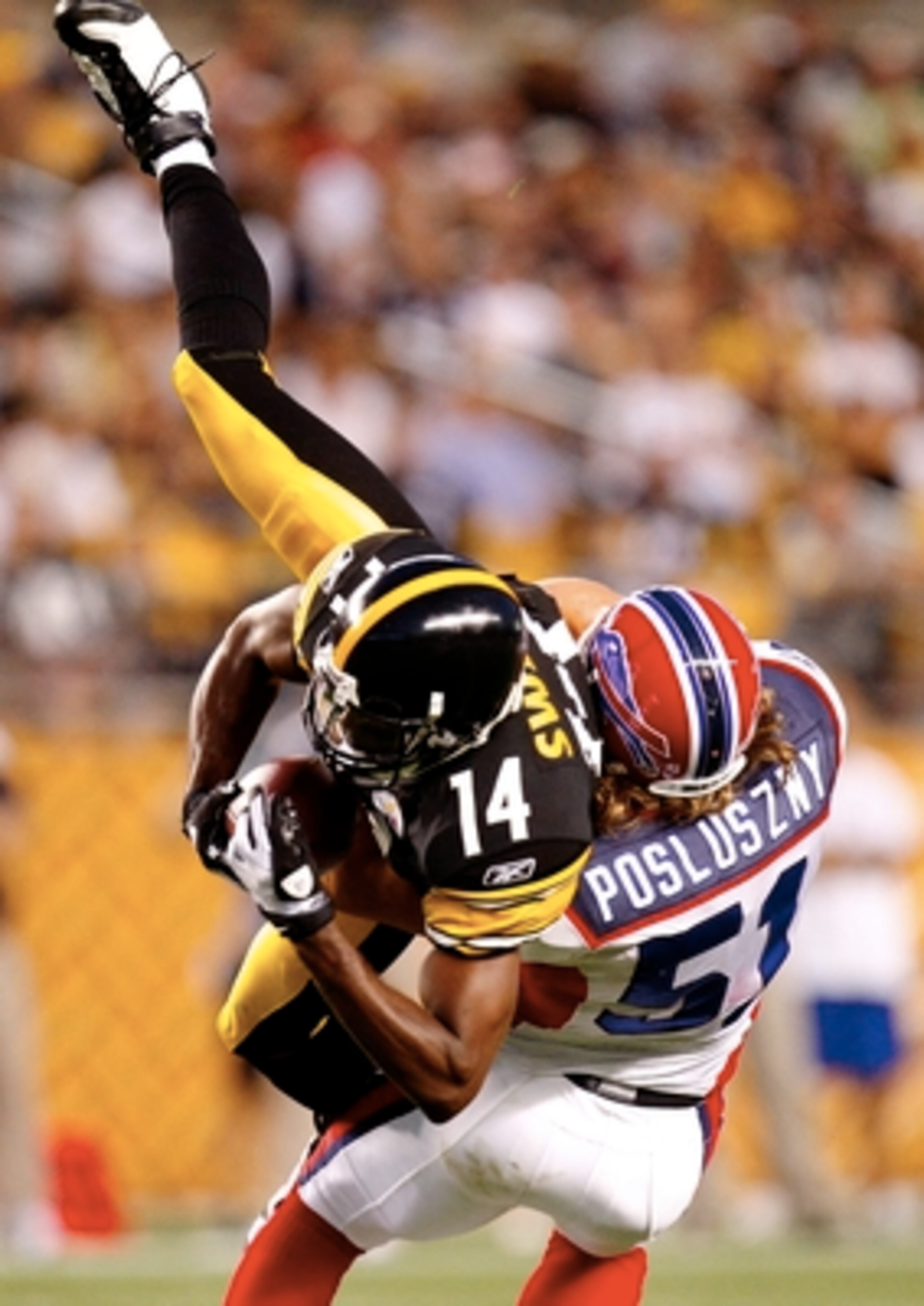 PITTSBURGH - AUGUST 29: Wide Reciver Limas Sweed #14 of the Pittsburgh Steelers makes a frist down catch in the first quarter tackled by Paul Posluszny #51 of the Buffalo Bills at Heinz Field on August 29, 2009 in Pittsburgh, Pennsylvania. (Photo by Grego PITTSBURGH - AUGUST 29: Wide Reciver Limas Sweed #14 of the Pittsburgh Steelers makes a frist down catch in the first quarter tackled by Paul Posluszny #51 of the Buffalo Bills at Heinz Field on August 29, 2009 in Pittsburgh, Pennsylvania. (Photo by Grego