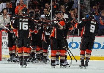 ANAHEIM, CA - APRIL 15:  (L-R) George Parros #16, Sheldon Brookbank #21 and Bobby Ryan #9 of the Anaheim Ducks congratulate each other following their teams victory over the Nashville Predators in Game Two of the Western Conference Quarterfinals during th
