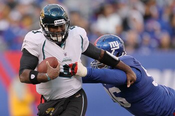 EAST RUTHERFORD, NJ - NOVEMBER 28:  David Garrard #9 of the Jacksonville Jaguars is sacked by Barry Cofield #96 of the New York Giants at New Meadowlands Stadium on November 28, 2010 in East Rutherford, New Jersey.  (Photo by Chris McGrath/Getty Images)