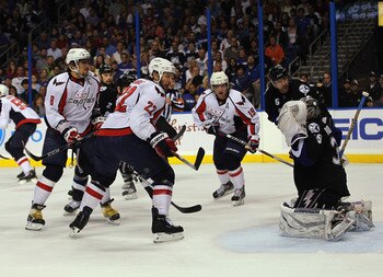 TAMPA, FL - MAY 04: Alex Ovechkin #8, Mike Knuble #22, and Nicklas Backstrom #19 of the Washington Capitals skate against Dwayne Roloson #35 of the Tampa Bay Lightning in Game Four of the Eastern Conference Semifinals during the 2011 NHL Stanley Cup Playo