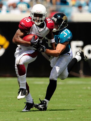 JACKSONVILLE, FL - SEPTEMBER 20:  Steve Breaston #15 of the Arizona Cardinals is chased by Sean Considine #37 of the Jacksonville Jaguars during the game at Jacksonville Municipal Stadium on September 20, 2009 in Jacksonville, Florida.  (Photo by Sam Gree