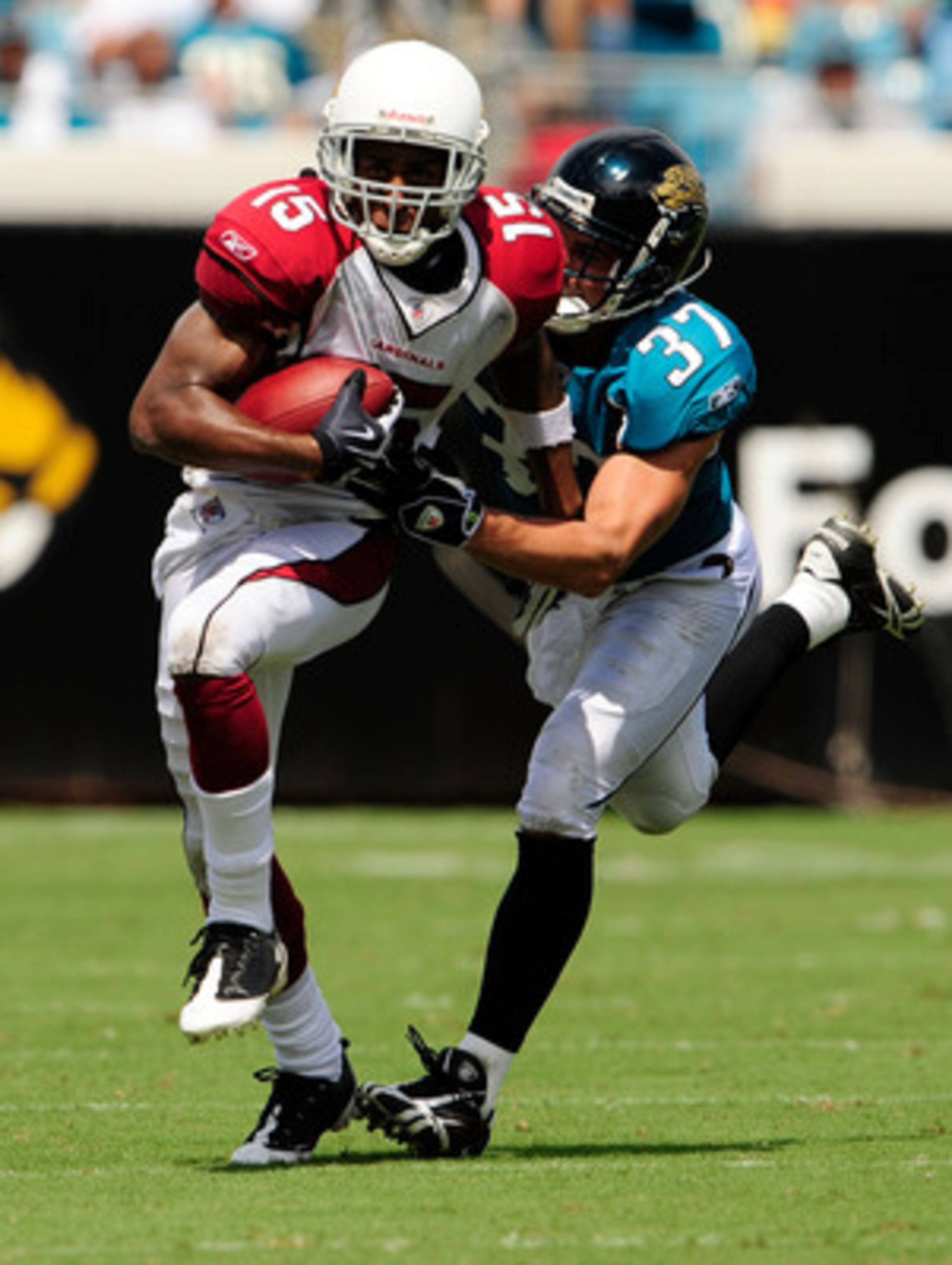 JACKSONVILLE, FL - SEPTEMBER 20:  Steve Breaston #15 of the Arizona Cardinals is chased by Sean Considine #37 of the Jacksonville Jaguars during the game at Jacksonville Municipal Stadium on September 20, 2009 in Jacksonville, Florida.  (Photo by Sam Gree