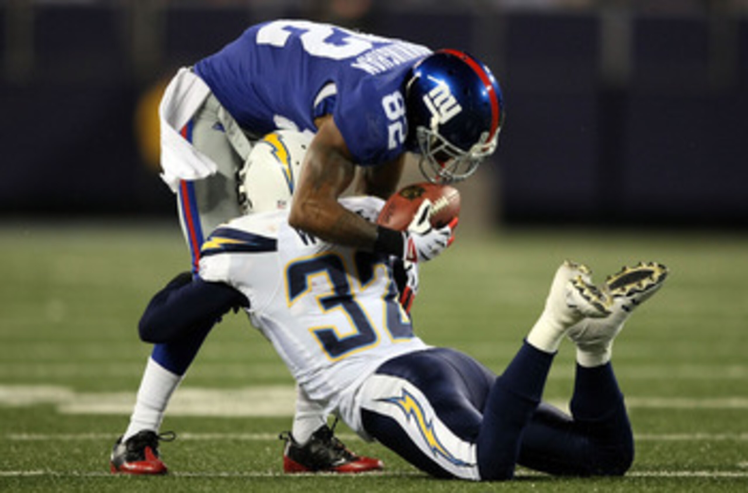 EAST RUTHERFORD, NJ - NOVEMBER 08: Mario Manningham #82 of the New York Giants is tackled by Eric Weddle #32 of the San Diego Chargers at Giants Stadium on November 8, 2009 in East Rutherford, New Jersey. (Photo by Nick Laham/Getty Images) EAST RUTHERFORD, NJ - NOVEMBER 08: Mario Manningham #82 of the New York Giants is tackled by Eric Weddle #32 of the San Diego Chargers at Giants Stadium on November 8, 2009 in East Rutherford, New Jersey. (Photo by Nick Laham/Getty Images)