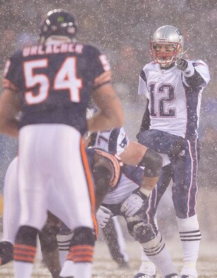 CHICAGO, IL - DECEMBER 12: Tom Brady #12 of the New England Patriots directs the offense against the Chicago Bears at Soldier Field on December 12, 2010 in Chicago, Illinois.  The Patriots beat the Bears 36-7.  (Photo by Dilip Vishwanat/Getty Images)