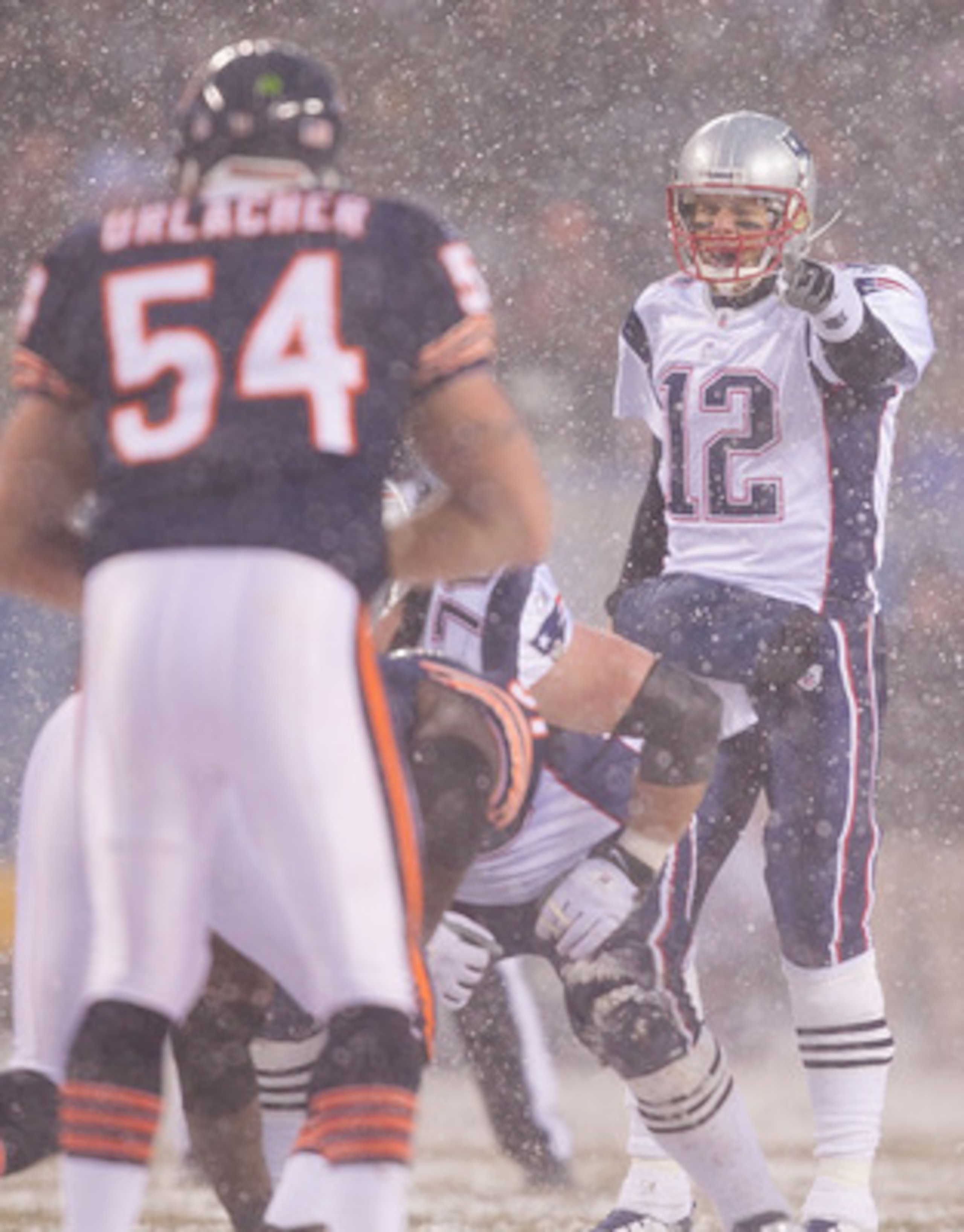 CHICAGO, IL - DECEMBER 12: Tom Brady #12 of the New England Patriots directs the offense against the Chicago Bears at Soldier Field on December 12, 2010 in Chicago, Illinois.  The Patriots beat the Bears 36-7.  (Photo by Dilip Vishwanat/Getty Images)