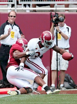 TUSCALOOSA, AL - APRIL 17: Running back Trent Richardson #3 of the Alabama Crimson Tide scores a touchdown despite the defense of Nico Johnson #35 during the Alabama spring game at Bryant Denny Stadium on April 17, 2010 in Tuscaloosa, Alabama. (Photo by D