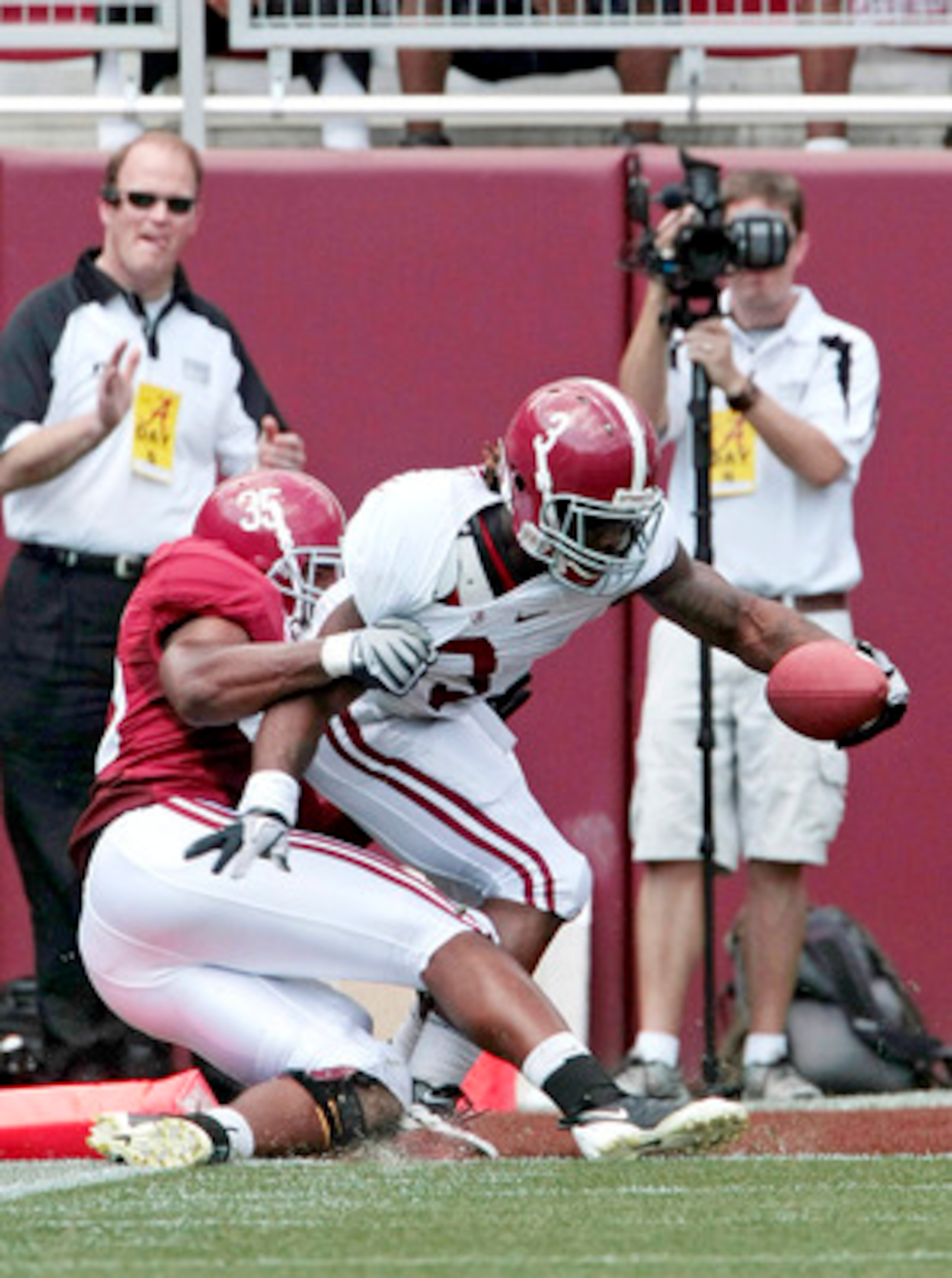 TUSCALOOSA, AL - APRIL 17: Running back Trent Richardson #3 of the Alabama Crimson Tide scores a touchdown despite the defense of Nico Johnson #35 during the Alabama spring game at Bryant Denny Stadium on April 17, 2010 in Tuscaloosa, Alabama. (Photo by D