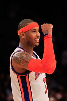 NEW YORK, NY - MARCH 30:  Carmelo Anthony #7 of the New York Knicks celebrates during the game against the New Jersey Nets at Madison Square Garden on March 30, 2011 in New York City. NOTE TO USER: User expressly acknowledges and agrees that, by downloadi
