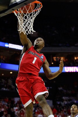 CHARLOTTE, NC - MARCH 18:  Travis Leslie #1 of the Georgia Bulldogs dunks the ball in the first half while taking on the Washington Huskies during the second round of the 2011 NCAA men's basketball tournament at Time Warner Cable Arena on March 18, 2011 i