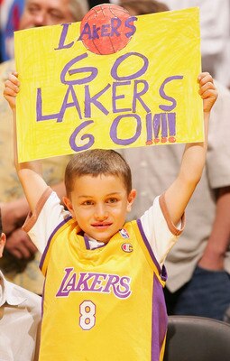 LOS ANGELES - NOVEMBER 18:   A young Lakers fan watches the Los Angeles Clippers take on the Los Angeles Lakers on November 18, 2005 at Staples Center in Los Angeles, California. NOTE TO USER: User expressly acknowledges and agrees that, by downloading an