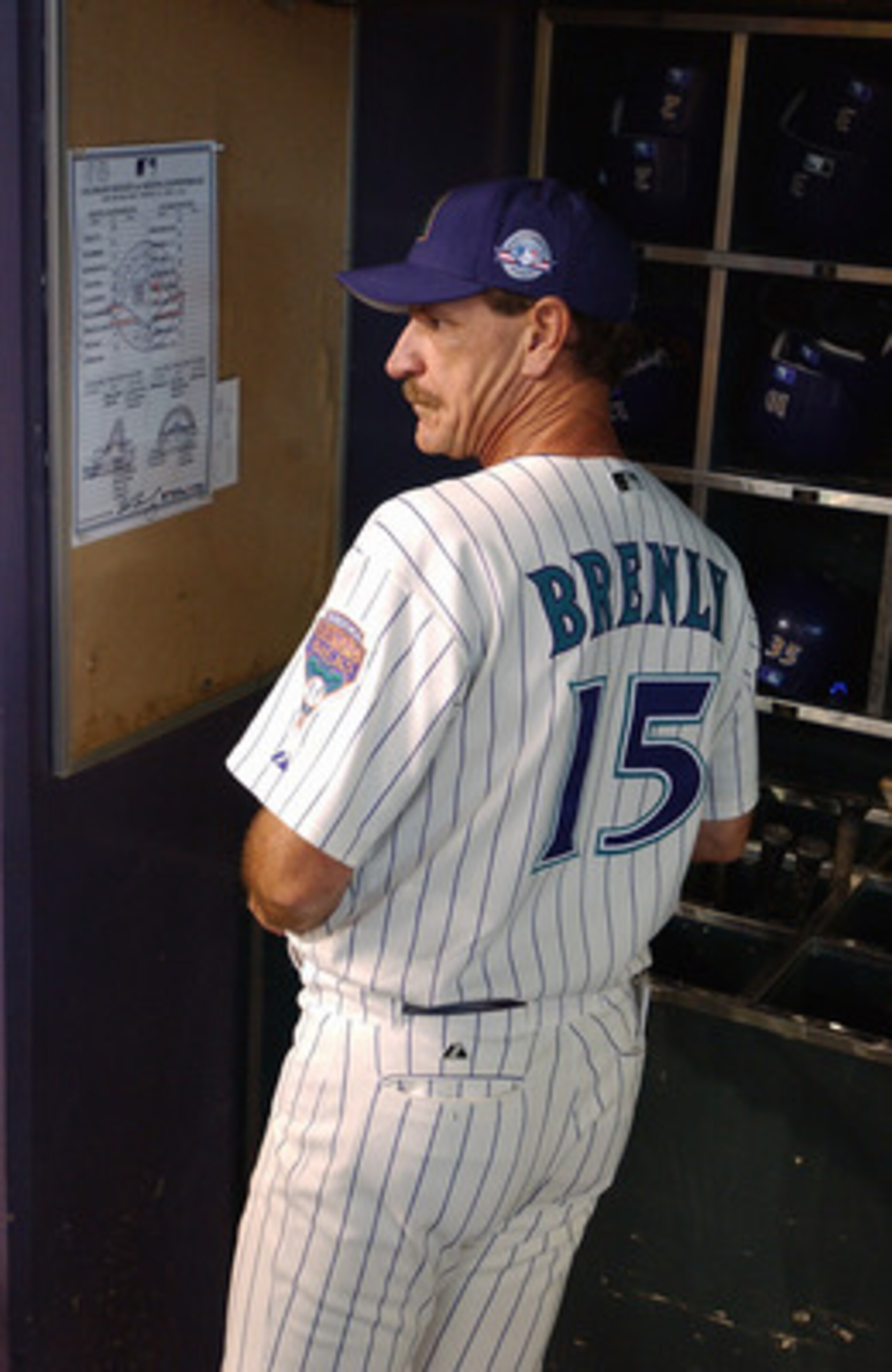 PHOENIX - APRIL 6:  Manager Bob Brenly #15 of the Arizona Diamondbacks watches the Opening Day game against the Colorado Rockies at Bank One Ballpark on April 6, 2004 in Phoenix, Arizona.  The Rockies defeated the Diamondbacks 6-2. (Photo by Barry Gossage