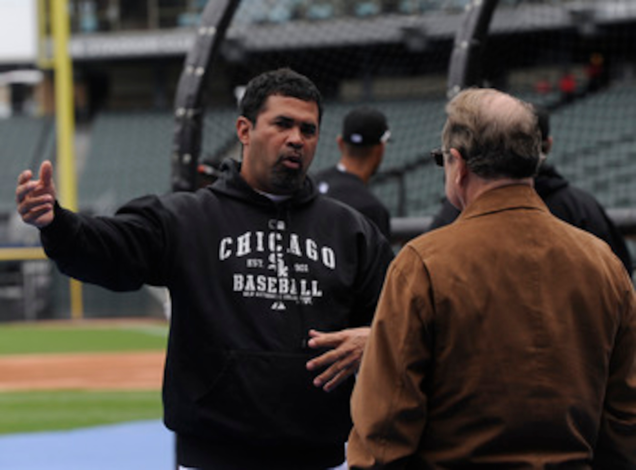 CHICAGO, IL - JUNE 11: Ozzie Guillen #13 of the Chicago White Sox (L)  talks with White Sox owner Jerry Reinsdorf  before the game against the Oakland Athletics on June 11, 2011 at U.S. Cellular Field in Chicago, Illinois.  (Photo by David Banks/Getty Ima