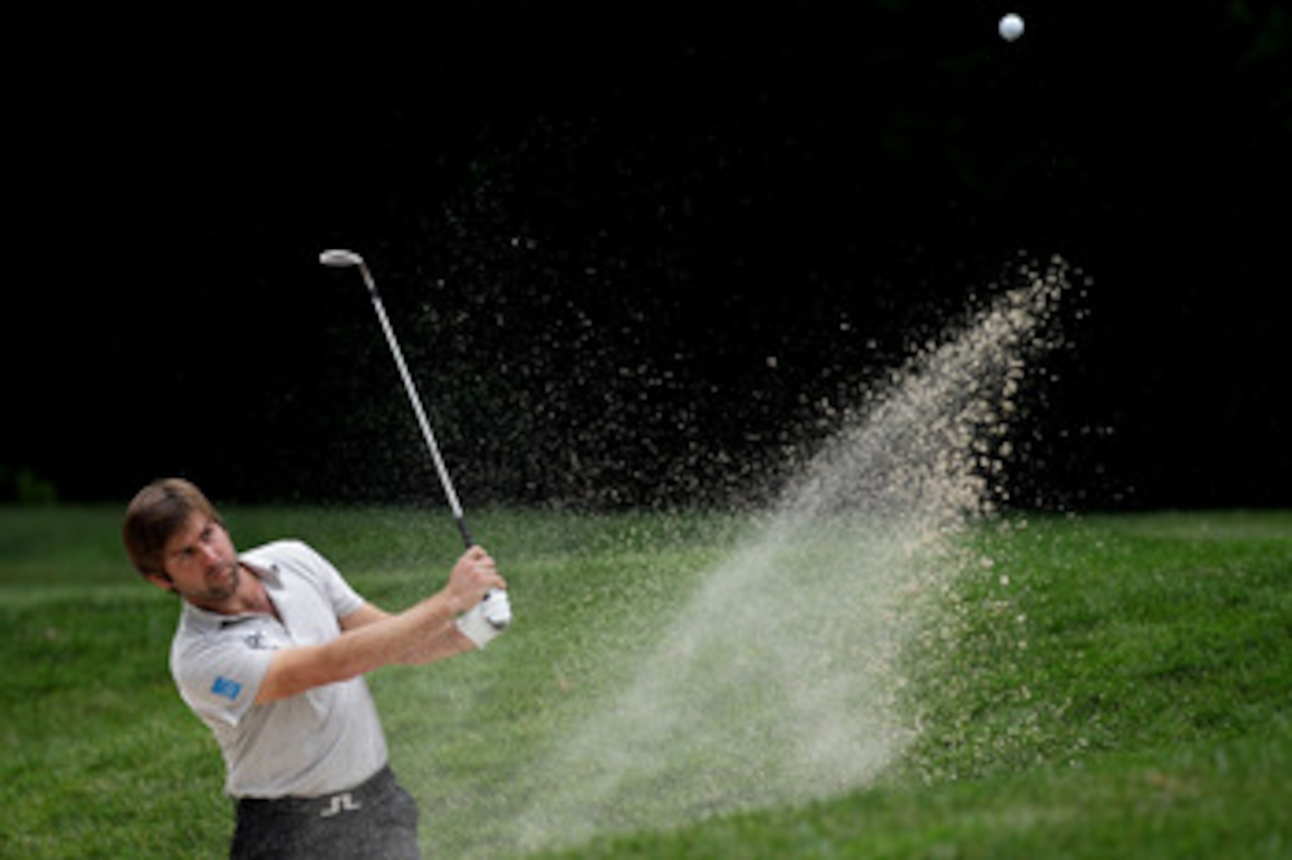 BETHESDA, MD - JUNE 16: Robert Rock of England plays a bunker shot on the 13th hole during the first round of the 111th U.S. Open at Congressional Country Club on June 16, 2011 in Bethesda, Maryland. (Photo by David Cannon/Getty Images) BETHESDA, MD - JUNE 16: Robert Rock of England plays a bunker shot on the 13th hole during the first round of the 111th U.S. Open at Congressional Country Club on June 16, 2011 in Bethesda, Maryland. (Photo by David Cannon/Getty Images)