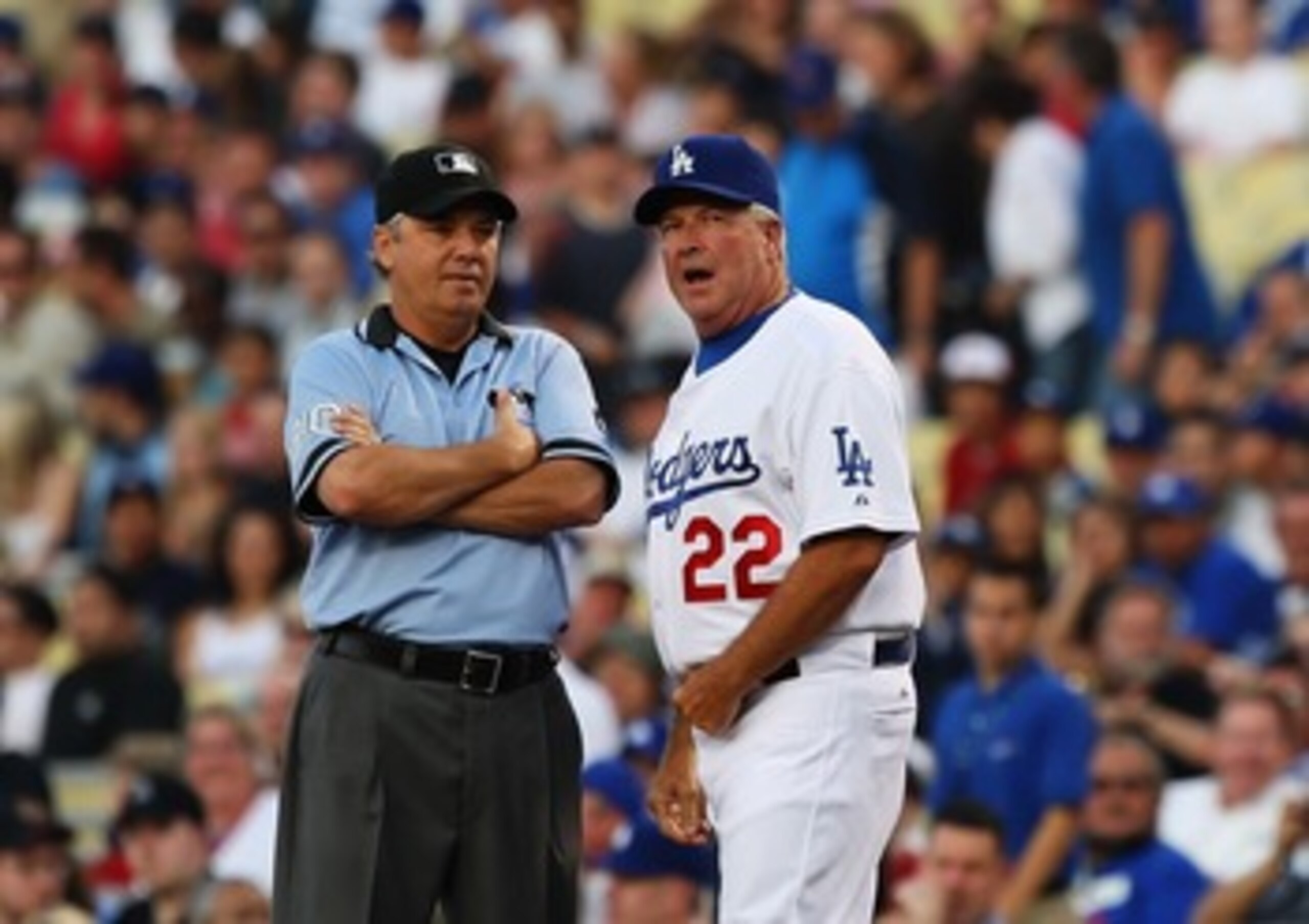 LOS ANGELES, CA - AUGUST 15:  (R)Manager Grady Little  of the Los Angeles Dodgers talks with first base umpire Tom Hallion during the game against the Houston Astros at Dodger Stadium on August 15, 2007 in Los Angeles, California.  (Photo by Lisa Blumenfe