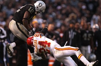 OAKLAND, CA - NOVEMBER 07:  Jacoby Ford #12 of the Oakland Raiders catches a pass over Brandon Flowers #24 of the Kansas City Chiefs during an NFL game at Oakland-Alameda County Coliseum on November 7, 2010 in Oakland, California.  (Photo by Jed Jacobsohn