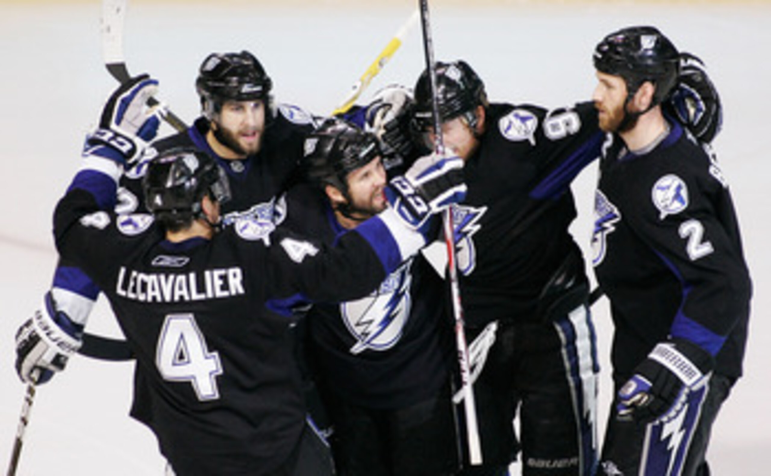 TAMPA, FL - MAY 25: Martin St. Louis #26 of the Tampa Bay Lightning celebrates his second period goal with teammates in Game Six of the Eastern Conference Finals against the Boston Bruins during the 2011 NHL Stanley Cup Playoffs at St Pete Times Forum on TAMPA, FL - MAY 25: Martin St. Louis #26 of the Tampa Bay Lightning celebrates his second period goal with teammates in Game Six of the Eastern Conference Finals against the Boston Bruins during the 2011 NHL Stanley Cup Playoffs at St Pete Times Forum on