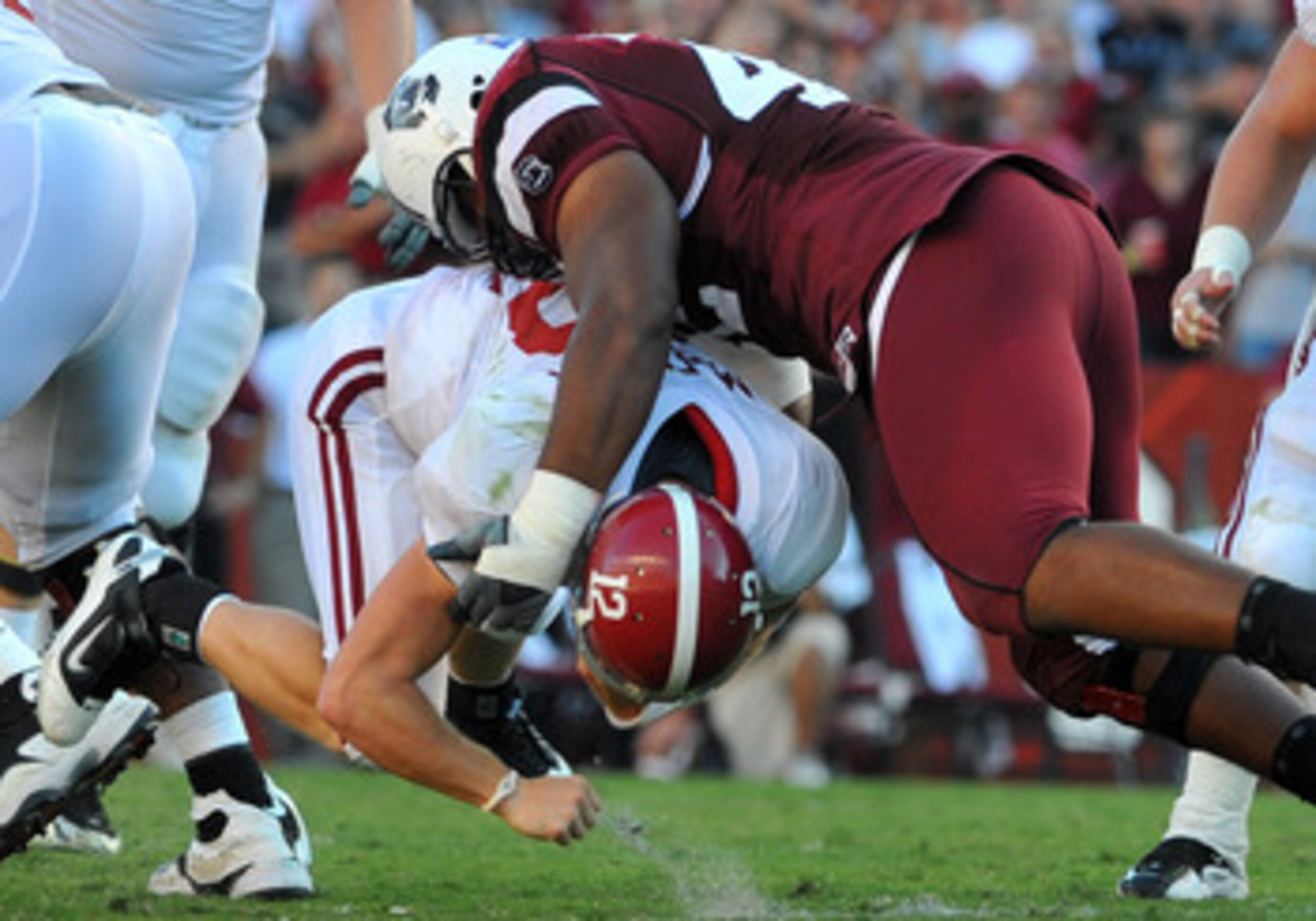 COLUMBIA, SC - OCTOBER 9:  Defensive tackle Travian Robertson #42 of the South Carolina Gamecocks tackles quarterback Greg McElroy of the Alabama Crimson Tide October 9, 2010 at Williams-Brice Stadium in Columbia, South Carolina.  (Photo by Al Messerschmi