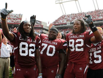 COLUMBIA, SC - SEPTEMBER 11: Tackle Byron Jerideau #70 (center), wide receiver D.L. Moore #82 (left) and defensive end Byron McKnight #92 (right) of the South Carolina Gamecocks during the game against the Georgia Bulldogs at Williams-Brice Stadium on Sep