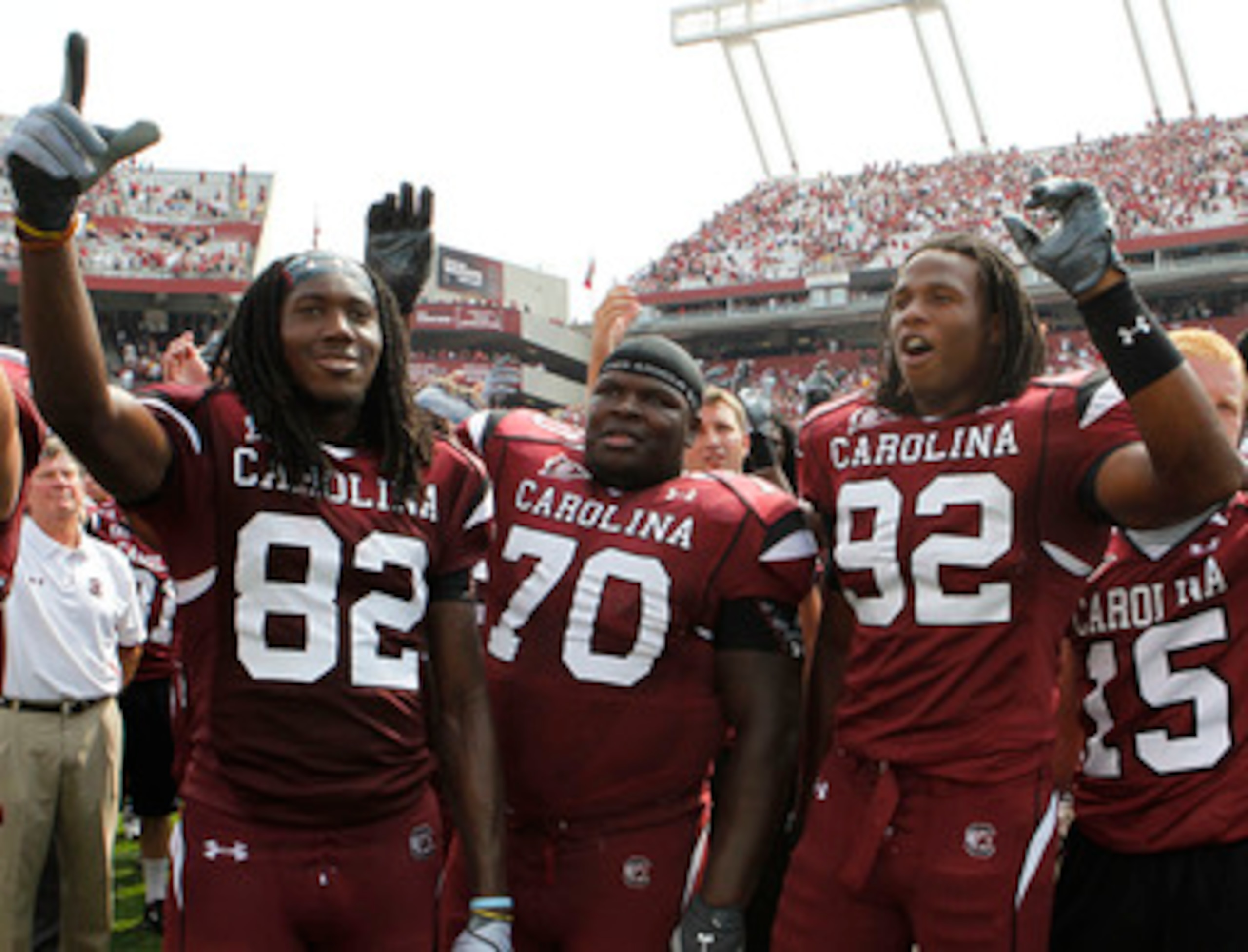 COLUMBIA, SC - SEPTEMBER 11: Tackle Byron Jerideau #70 (center), wide receiver D.L. Moore #82 (left) and defensive end Byron McKnight #92 (right) of the South Carolina Gamecocks during the game against the Georgia Bulldogs at Williams-Brice Stadium on Sep