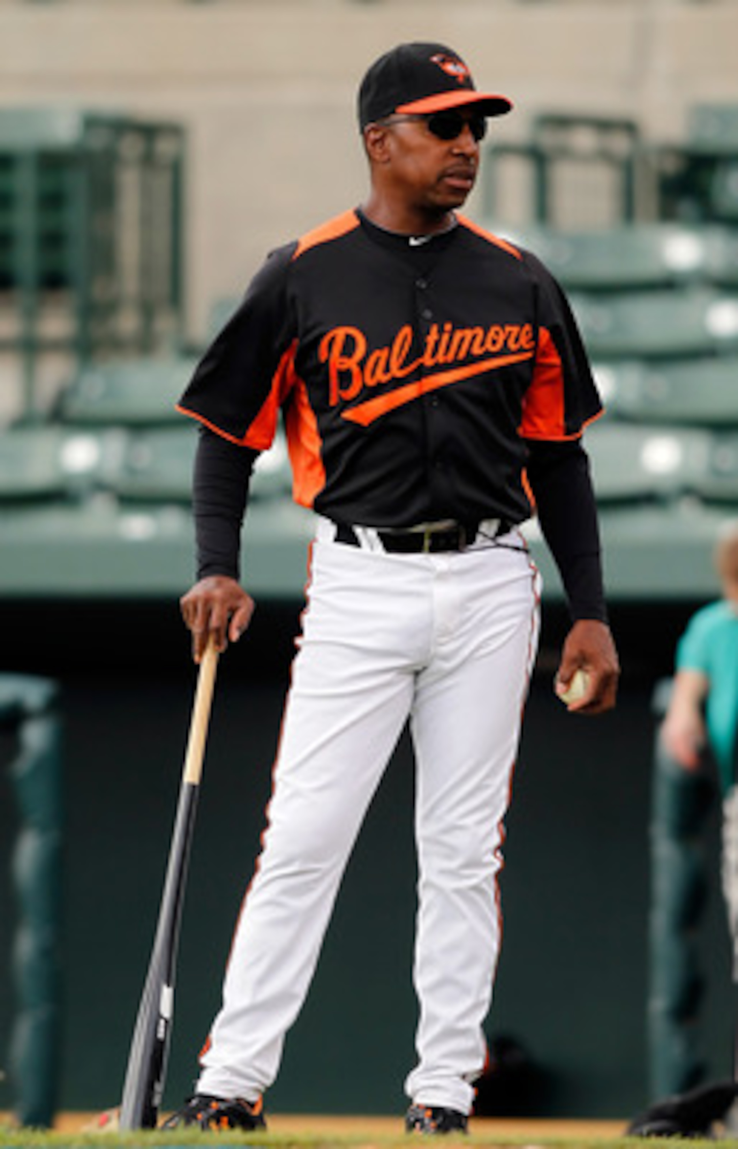 SARASOTA, FL - MARCH 05:  Coach Willie Randolph of the Baltimore Orioles works with the infield just before the start of the Grapefruit League Spring Training Game against the Boston Red Sox at Ed Smith Stadium on March 5, 2011 in Sarasota, Florida.  (Pho