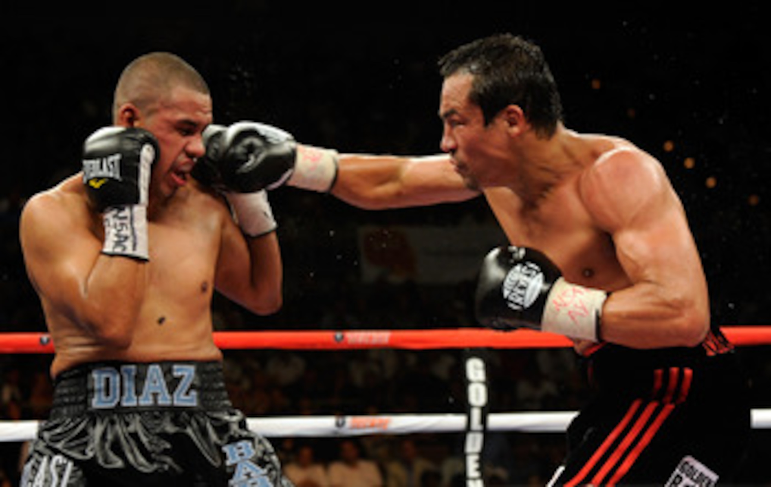 LAS VEGAS - JULY 31: WBA/WBO lightweight champion Juan Manuel Marquez (R) hits Juan Diaz in the eighth round of their bout at the Mandalay Bay Events Center July 31, 2010 in Las Vegas, Nevada. Marquez retained his WBA and WBO lightweight championship bel LAS VEGAS - JULY 31: WBA/WBO lightweight champion Juan Manuel Marquez (R) hits Juan Diaz in the eighth round of their bout at the Mandalay Bay Events Center July 31, 2010 in Las Vegas, Nevada. Marquez retained his WBA and WBO lightweight championship bel