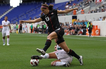 HARRISON, NJ - JUNE 05:  Alex Morgan #13 of the United States challenges Alina Garciamendez #4 of Mexico during their International Friendly at Red Bull Arena on June 5, 2011 in Harrison, New Jersey.  (Photo by Nick Laham/Getty Images)