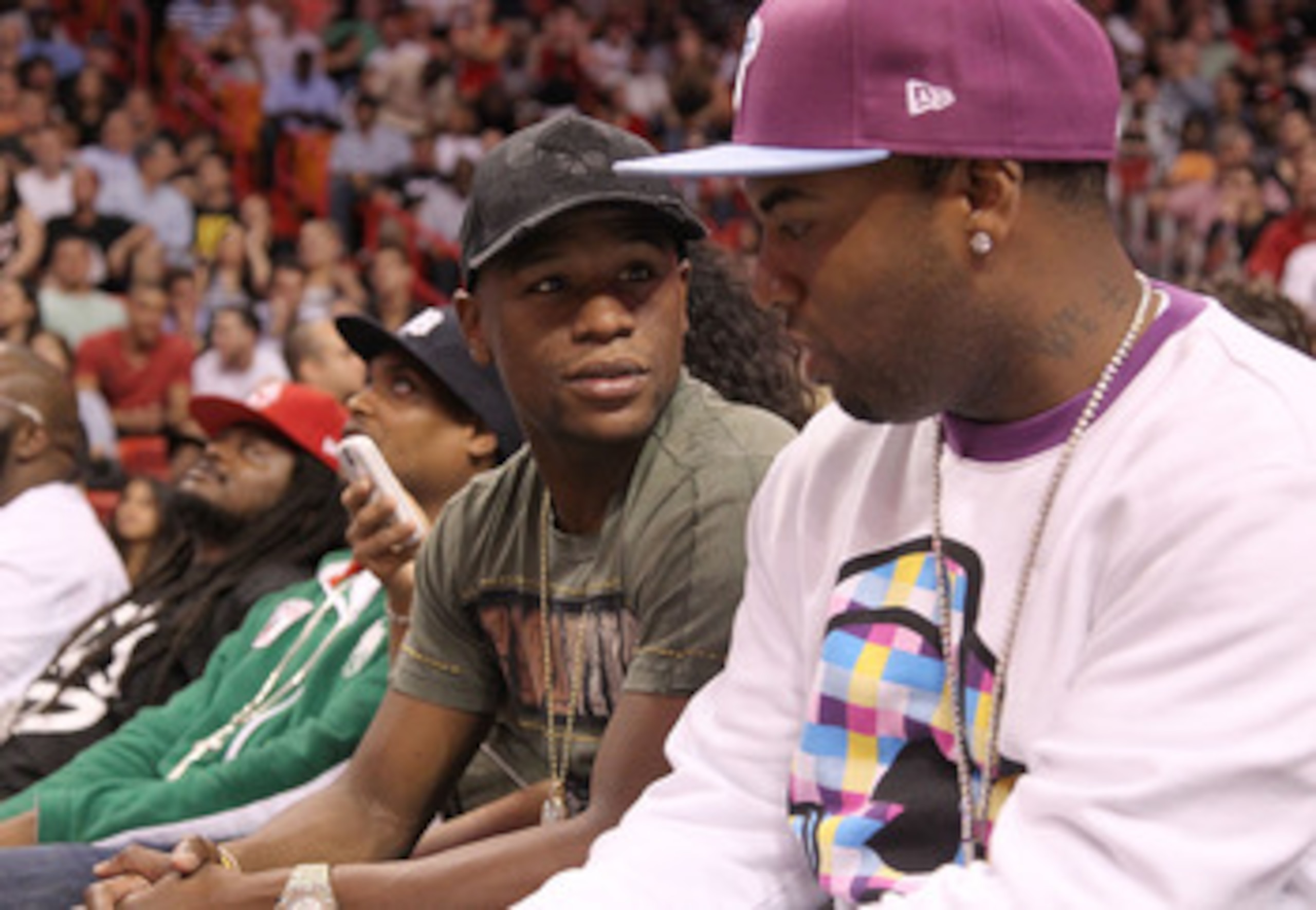 MIAMI, FL - NOVEMBER 29: Boxer Floyd Mayweather Jr watches a game between the Miami Heat and the Washington Wizards at American Airlines Arena on November 29, 2010 in Miami, Florida. NOTE TO USER: User expressly acknowledges and agrees that, by download MIAMI, FL - NOVEMBER 29: Boxer Floyd Mayweather Jr watches a game between the Miami Heat and the Washington Wizards at American Airlines Arena on November 29, 2010 in Miami, Florida. NOTE TO USER: User expressly acknowledges and agrees that, by download