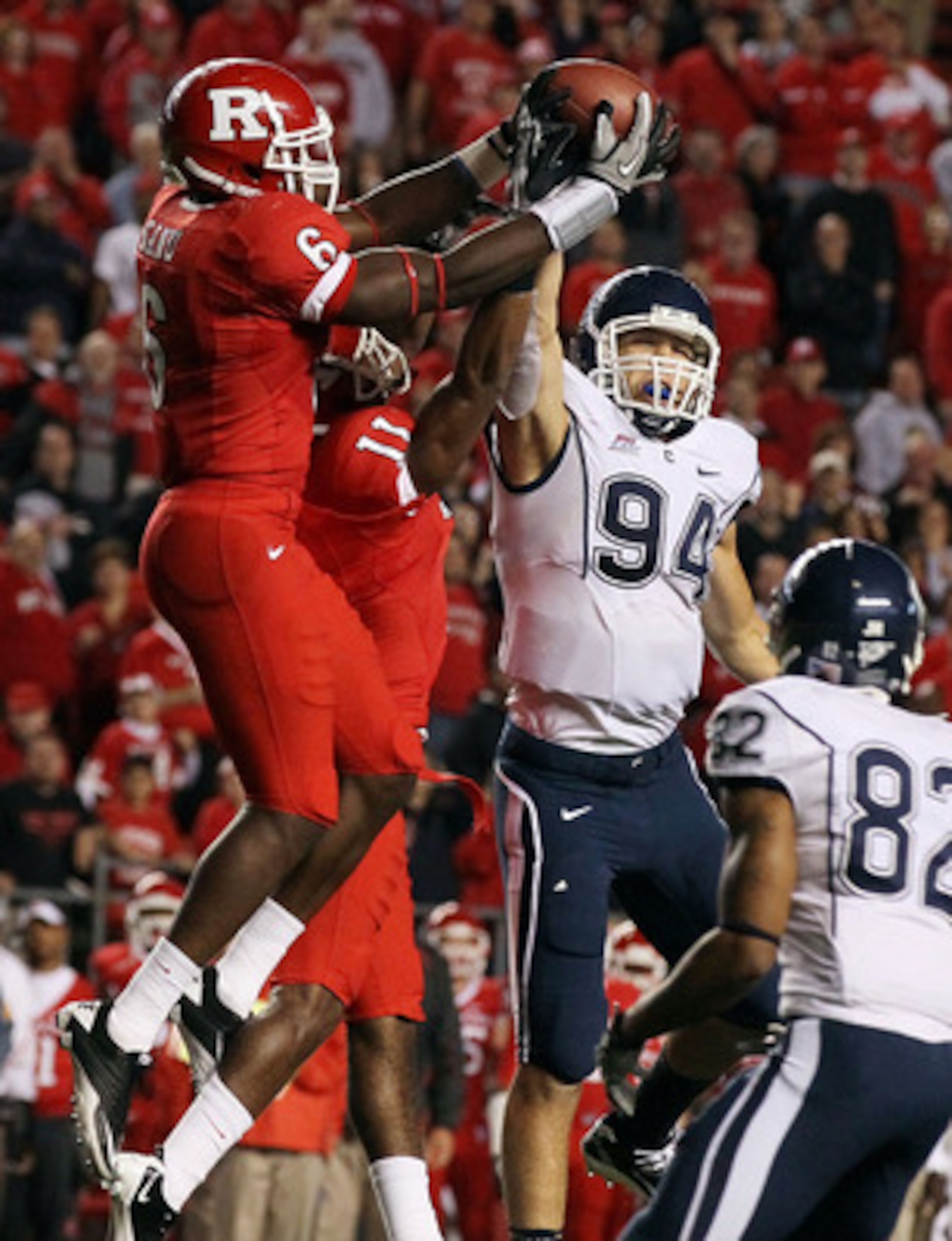 PISCATAWAY, NJ - OCTOBER 08:  Mohamed Sanu #6 of the Rutgers Scarlet Knights intercepts the ball intended for Ryan Griffin #94 of the Connecticut Huskies at Rutgers Stadium on the final play the clinch their victory on October 8, 2010 in Piscataway, New J