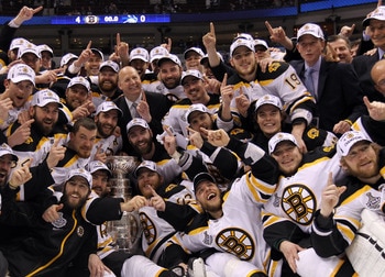 VANCOUVER, BC - JUNE 15:  The Boston Bruins pose with the Stanley Cup after defeating the Vancouver Canucks in Game Seven of the 2011 NHL Stanley Cup Final at Rogers Arena on June 15, 2011 in Vancouver, British Columbia, Canada. The Boston Bruins defeated