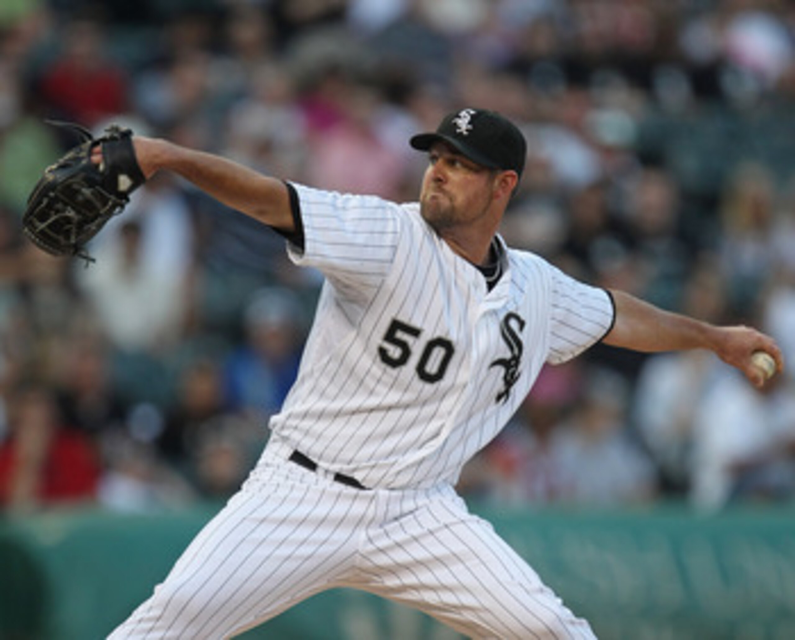CHICAGO, IL - JUNE 06:  Starting pitcher John Danks #50 of the Chicago White Sox delivers the ball against the Seattle Mariners at U.S. Cellular Field on June 6, 2011 in Chicago, Illinois. The White Sox defeated the Mariners 3-1.  (Photo by Jonathan Danie