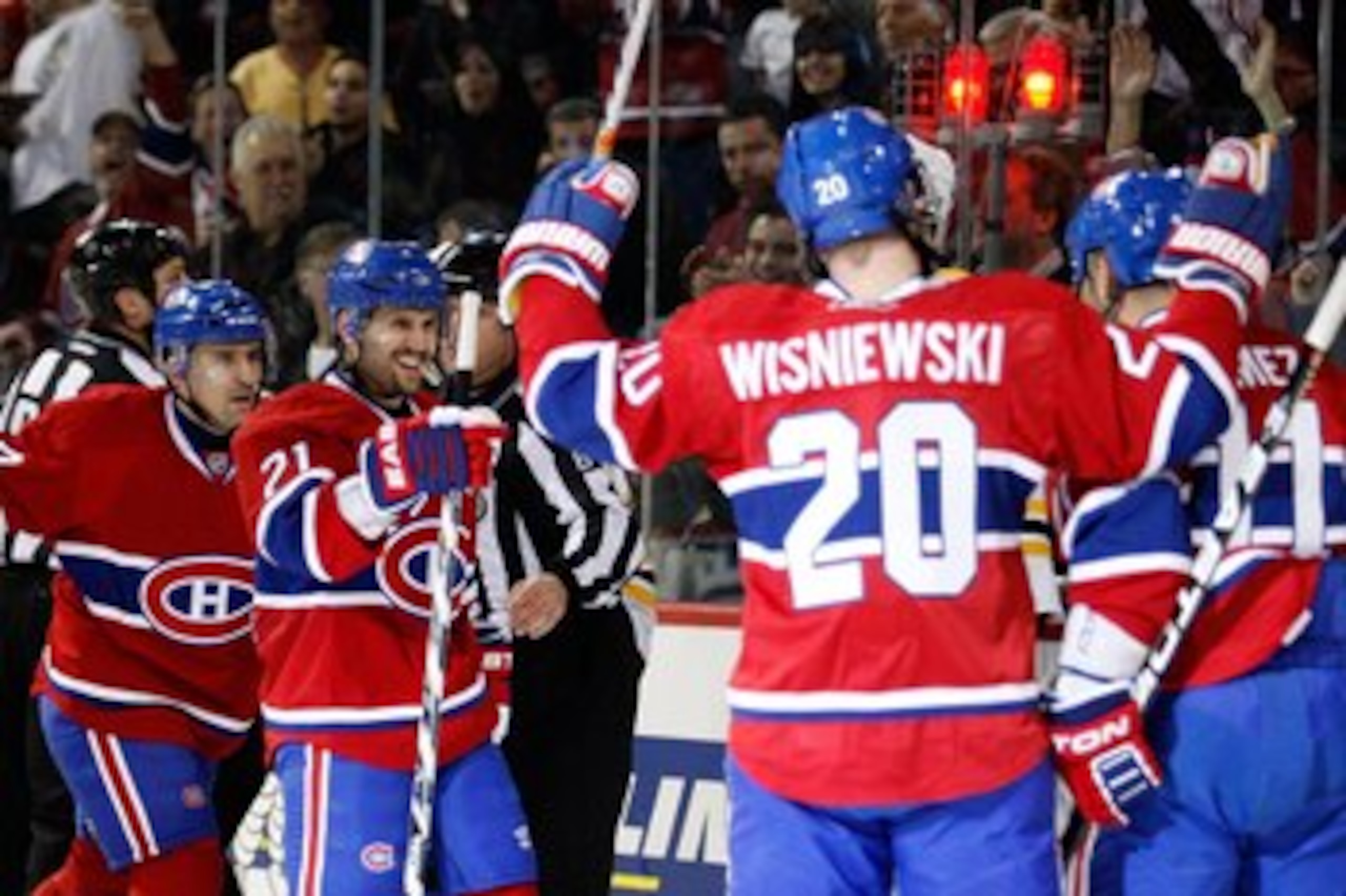 MONTREAL, CANADA - MARCH 8:  Members of the Montreal Canadiens celebrate a second period goal against the Boston Bruins during the NHL game at the Bell Centre on March 8, 2011 in Montreal, Quebec, Canada.  The Canadiens defeated the Bruins 4-1.  (Photo by
