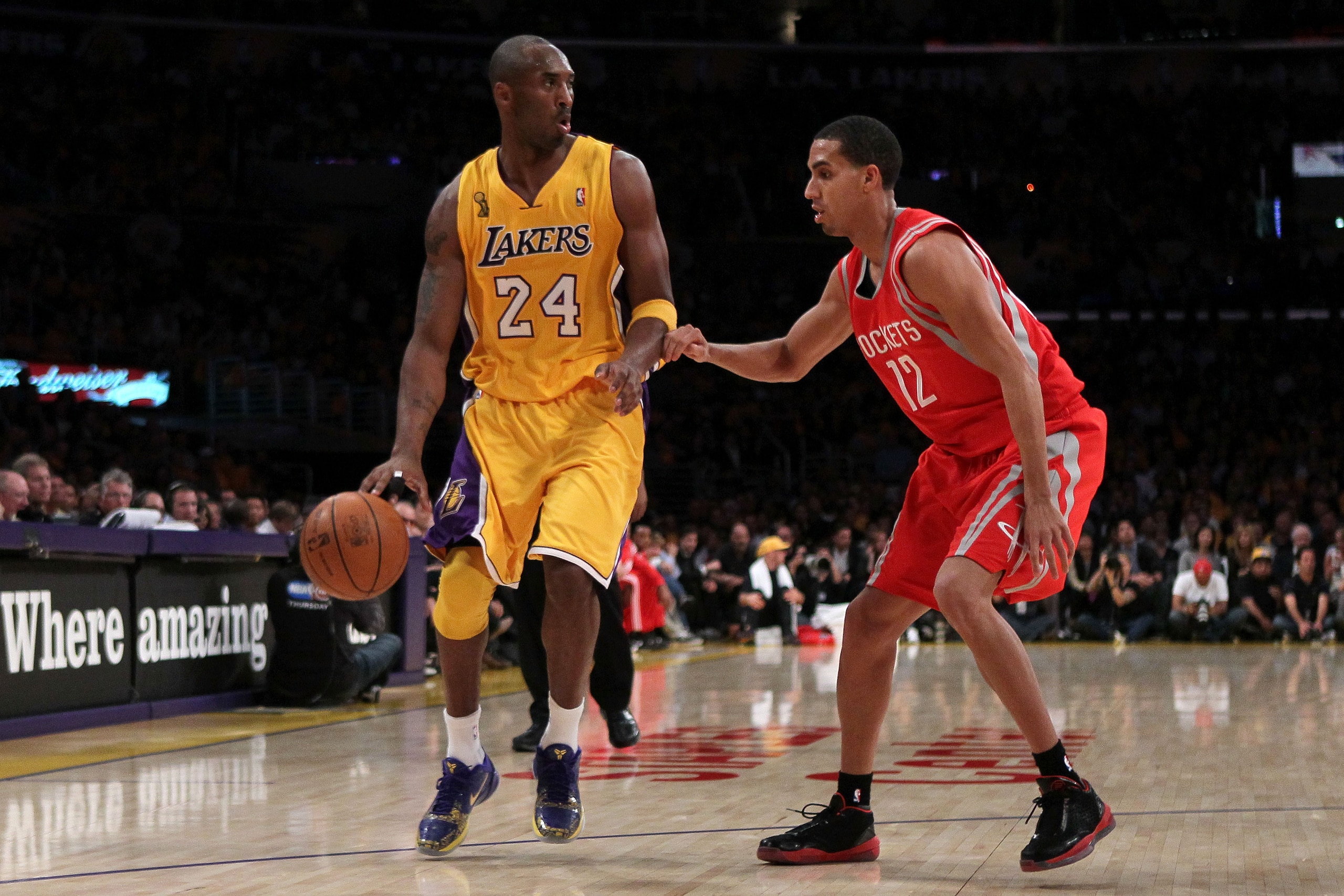 LOS ANGELES, CA - OCTOBER 26:  Kobe Bryant #24 of the Los Angeles Lakers drives with the ball against Kevin Martin #12 of the Houston Rockets during their opening night game at Staples Center on October 26, 2010 in Los Angeles, California. NOTE TO USER: U
