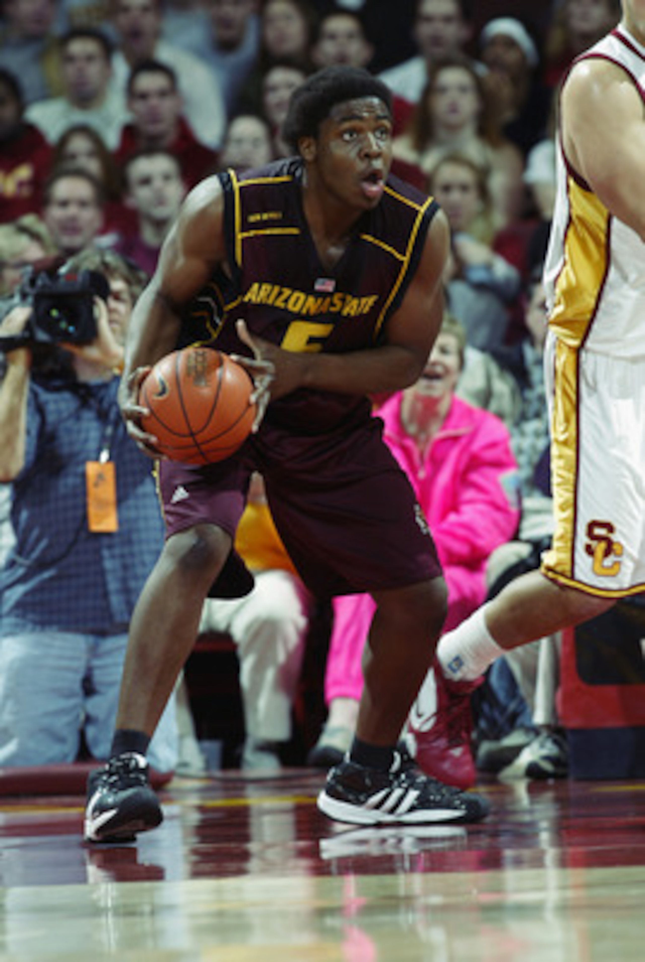 LOS ANGELES - JANUARY 18: Ike Diogu #5 of the Arizona State University Sun Devils holds the ball during the game against the University of Southern California Trojans at the Los Angeles Sports Arena on January 18, 2003 in Los Angeles, California. USC wo LOS ANGELES - JANUARY 18: Ike Diogu #5 of the Arizona State University Sun Devils holds the ball during the game against the University of Southern California Trojans at the Los Angeles Sports Arena on January 18, 2003 in Los Angeles, California. USC wo
