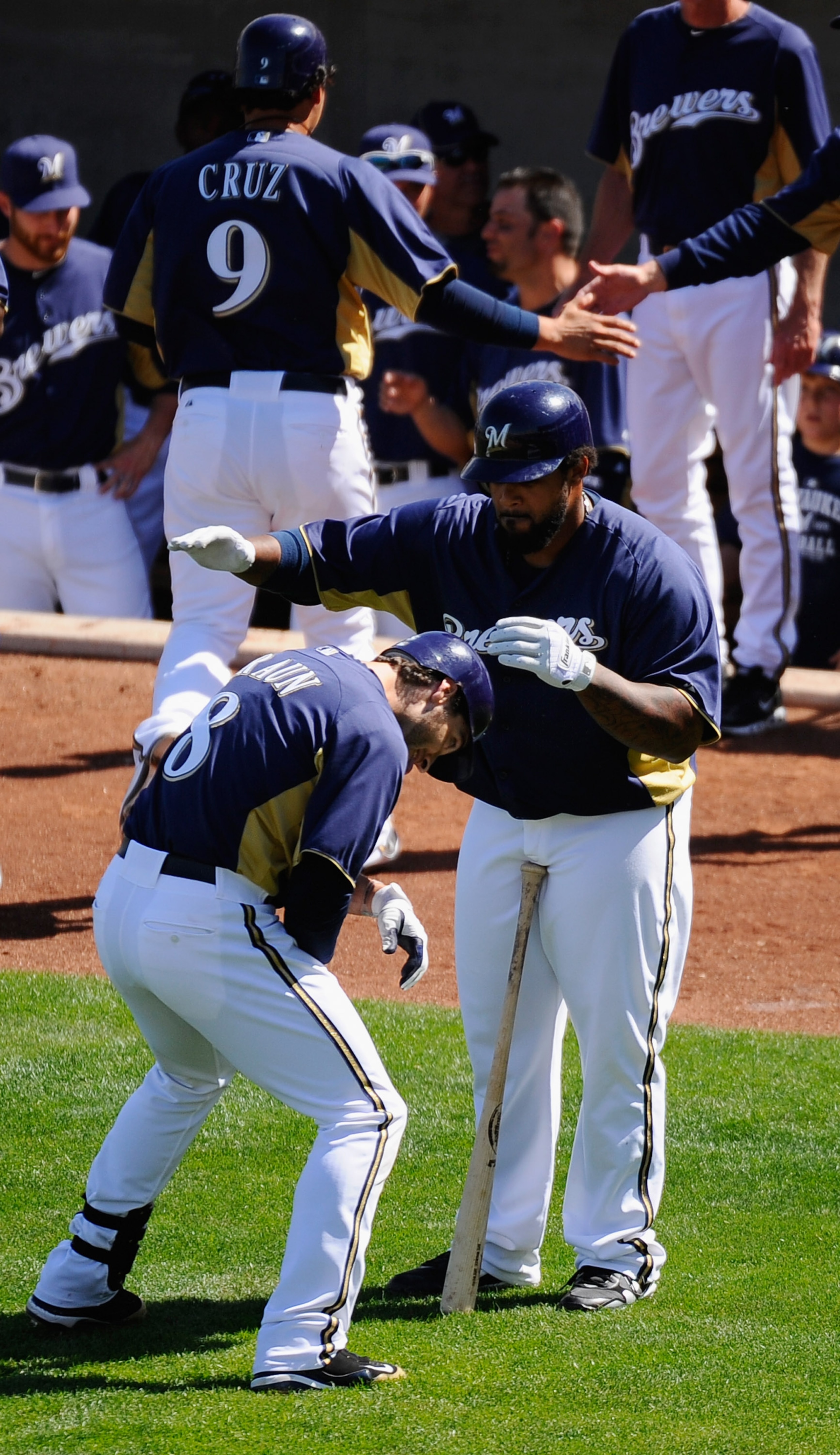 PHOENIX, AZ - MARCH 10:  Ryan Braun #8 of the Milwaukee Brewers is congratulated by teammate Prince Fielder#28 after hitting a three run home run against the Colorado Rockies in the third inning of the spring training baseball game at Maryvale Baseball Pa